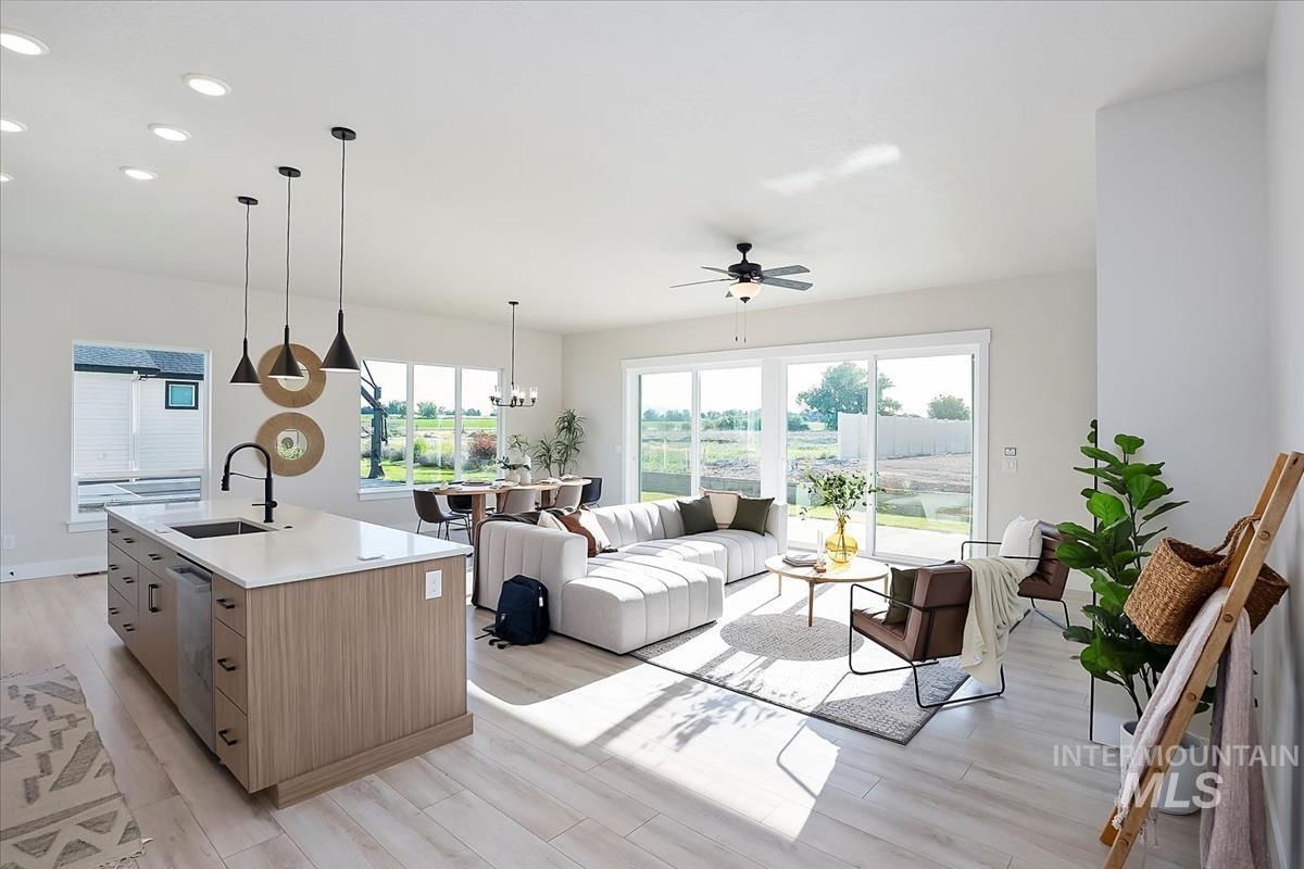 Kitchen featuring recessed lighting, light wood-type flooring, healthy amount of natural light, and a ceiling fan