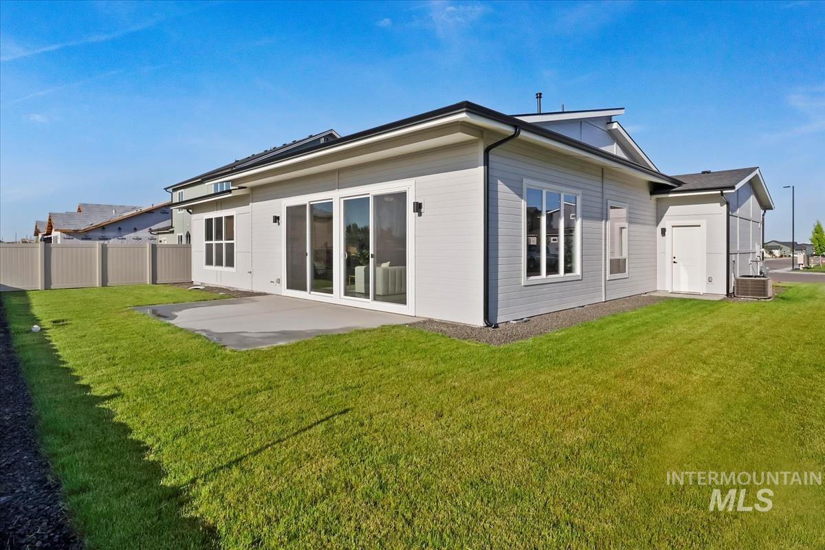 Rear view of house with a patio area