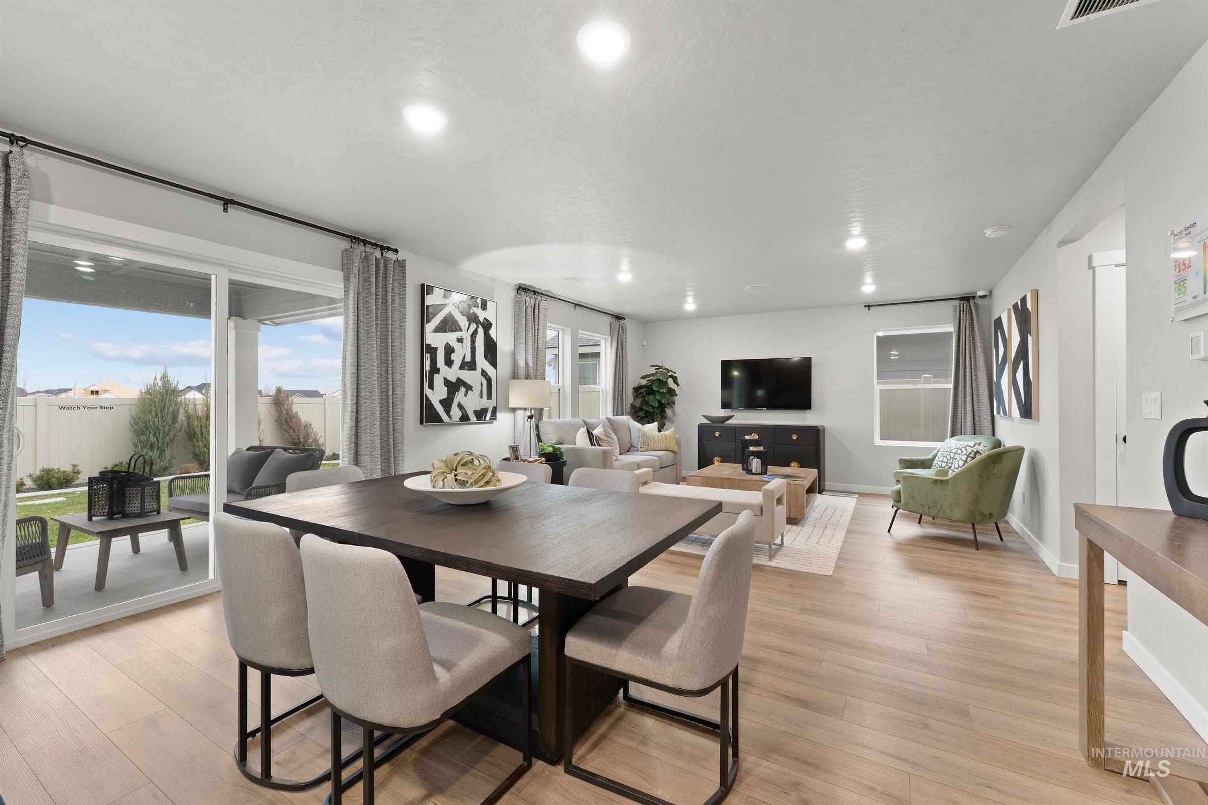 Dining space featuring light wood-type flooring and recessed lighting