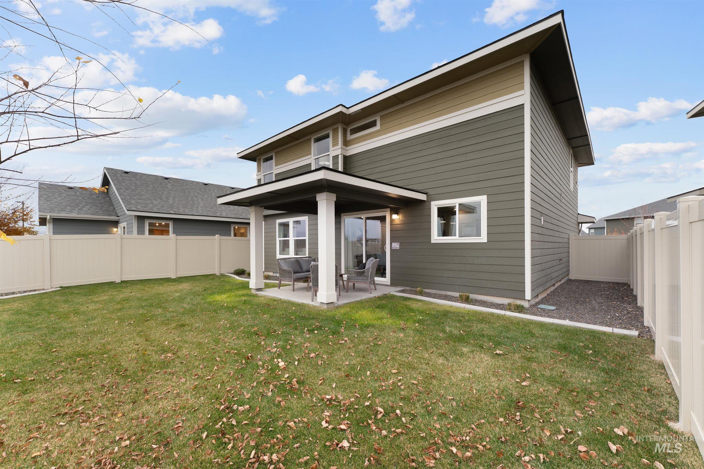Back of house featuring a patio and a fenced backyard