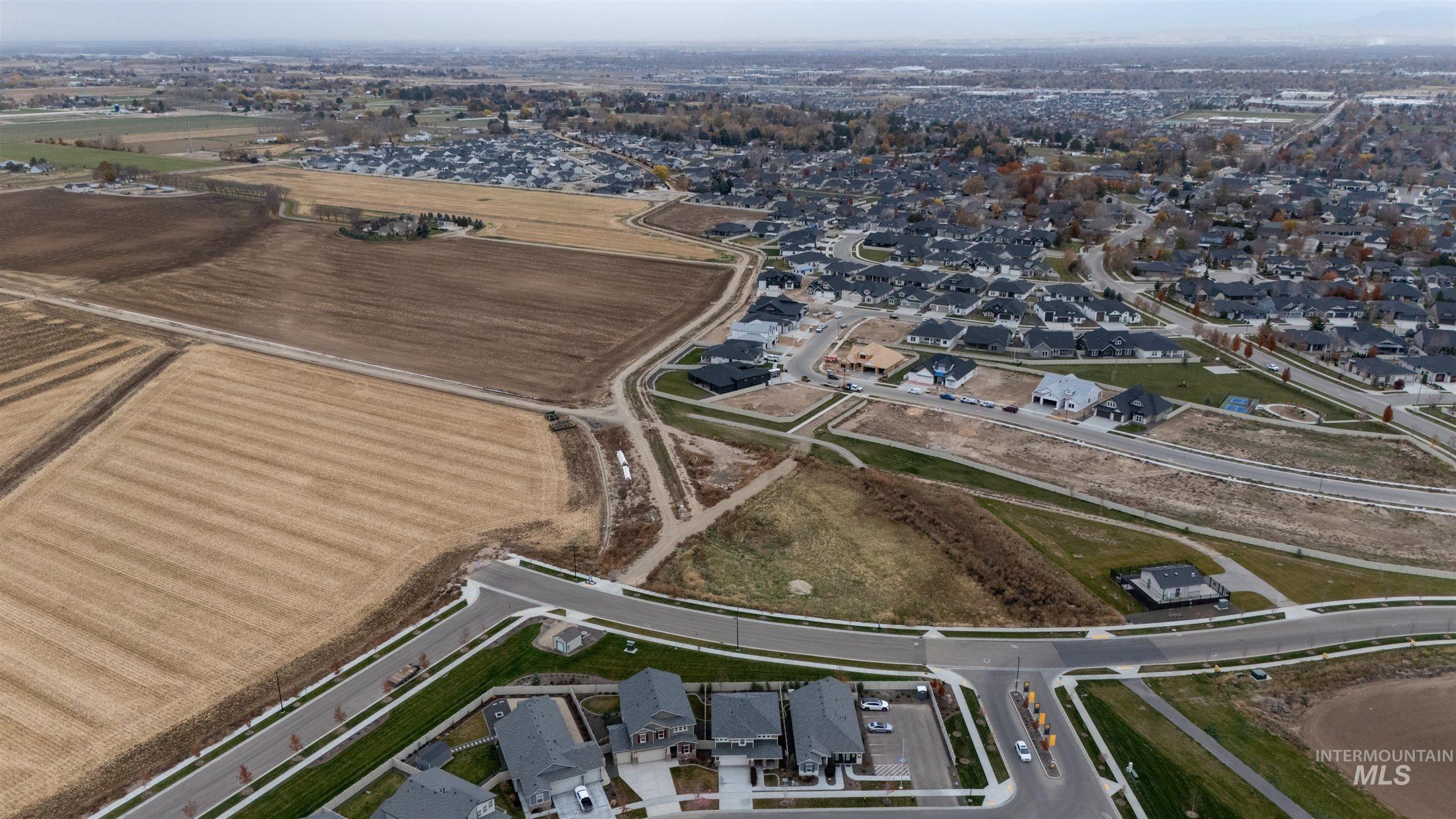 Aerial view of property's location featuring nearby suburban area