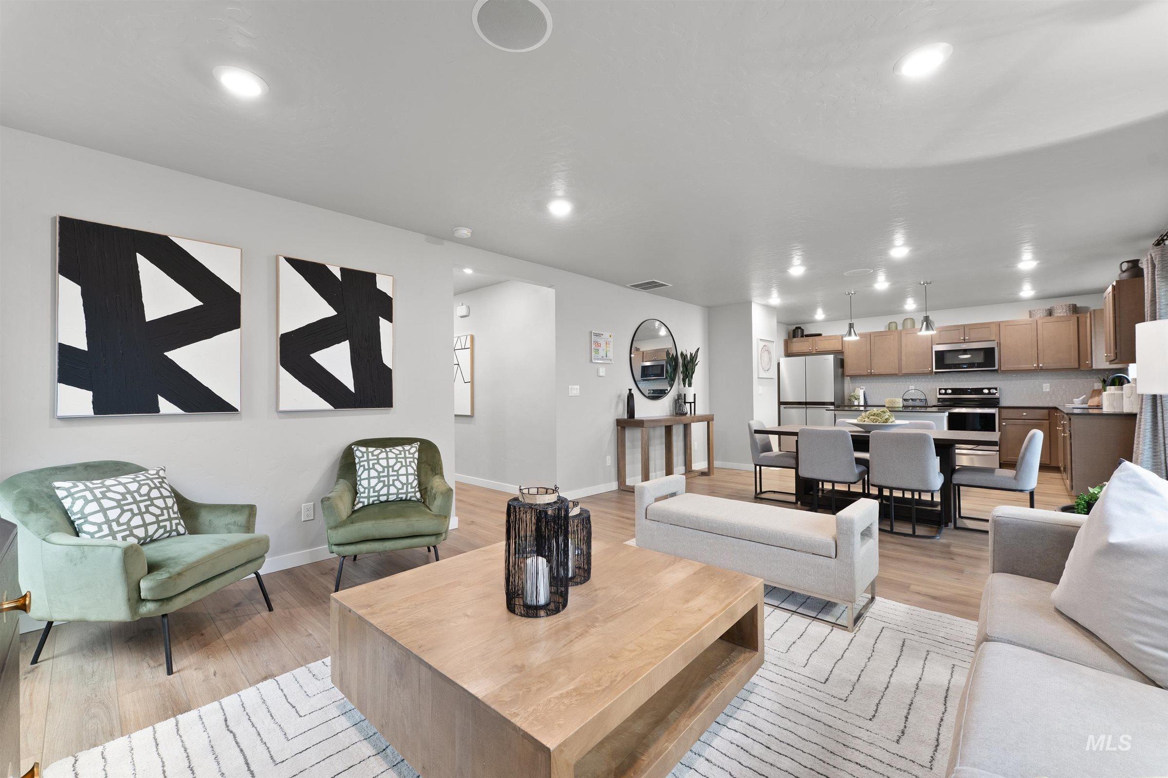 Living room featuring light wood-style floors and recessed lighting