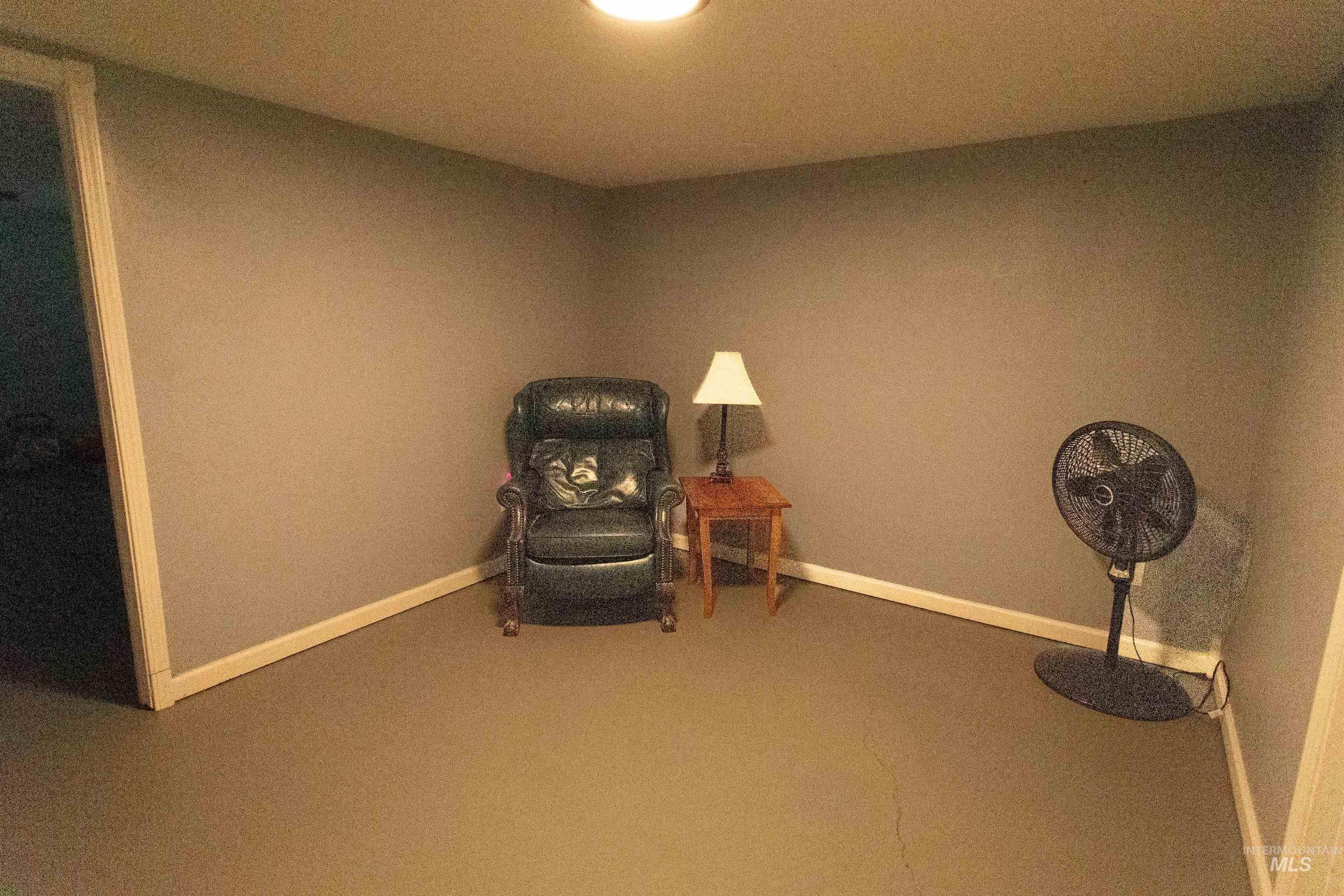 Unfurnished room with baseboards and carpet flooring