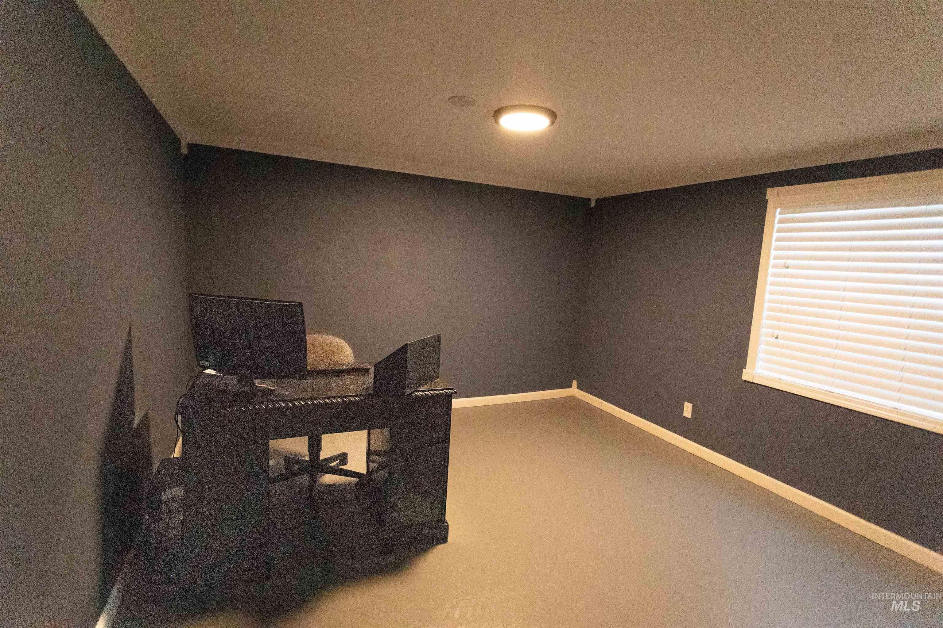 Office space featuring carpet flooring and baseboards