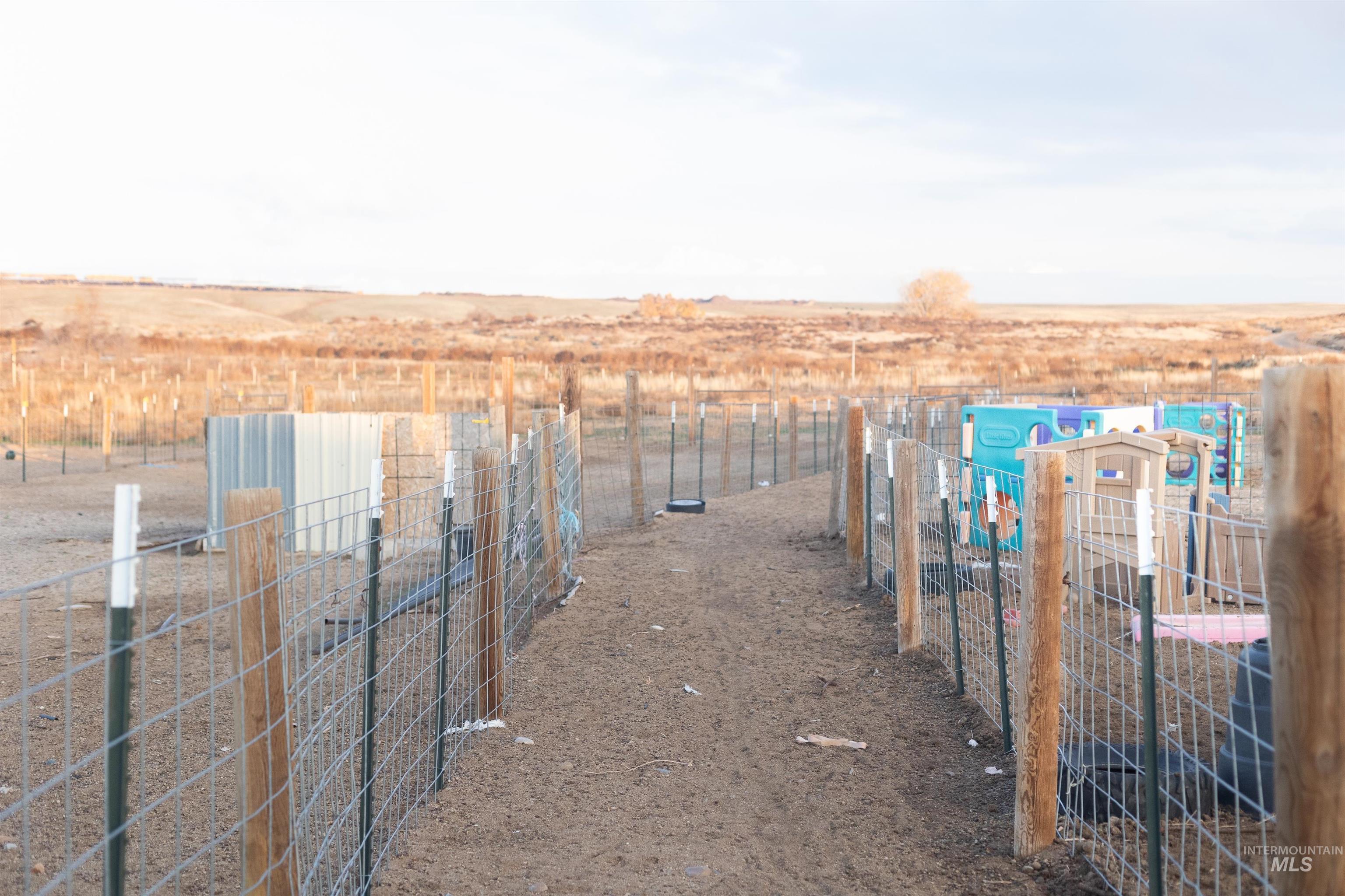 View of yard with a rural view