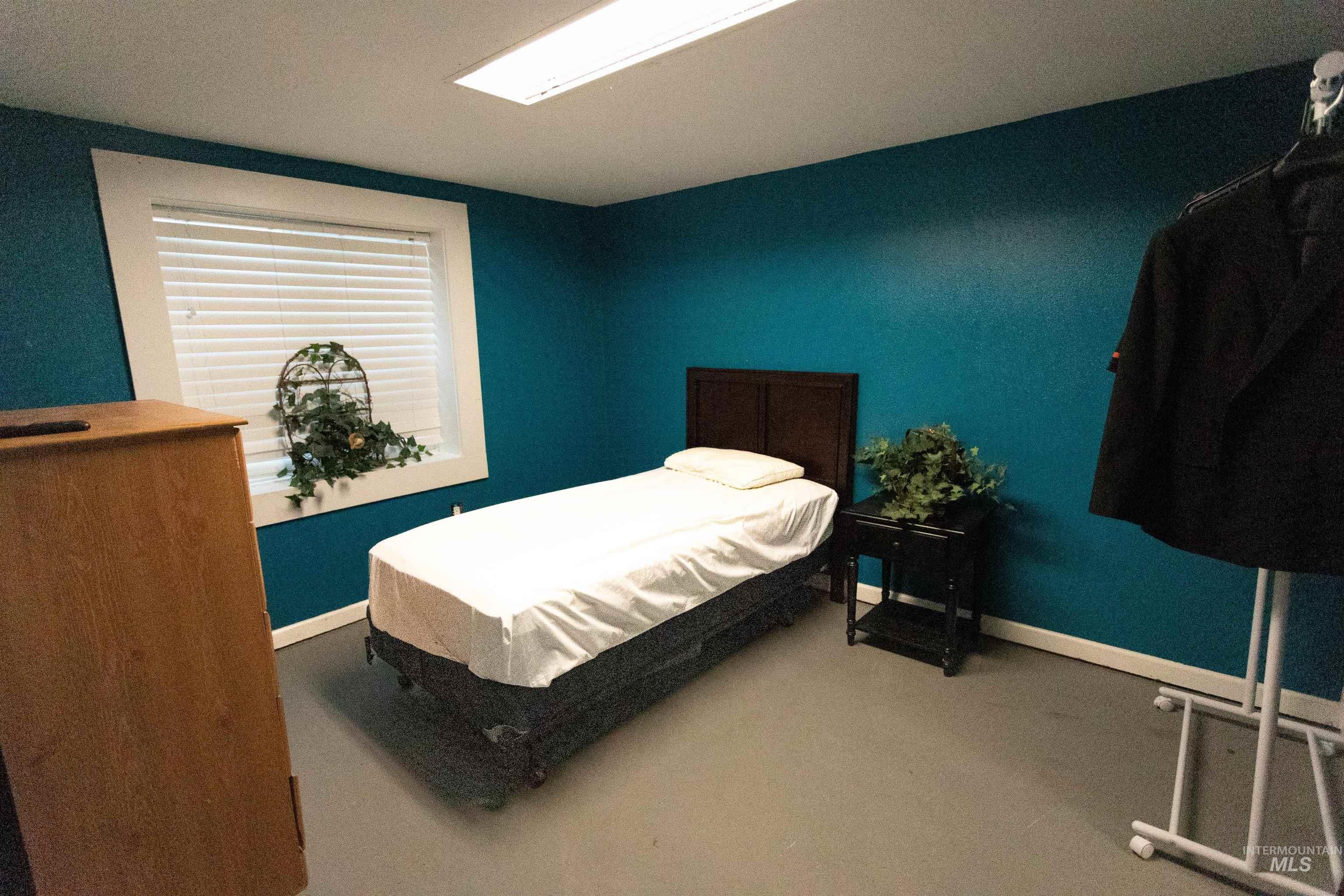 Bedroom with baseboards