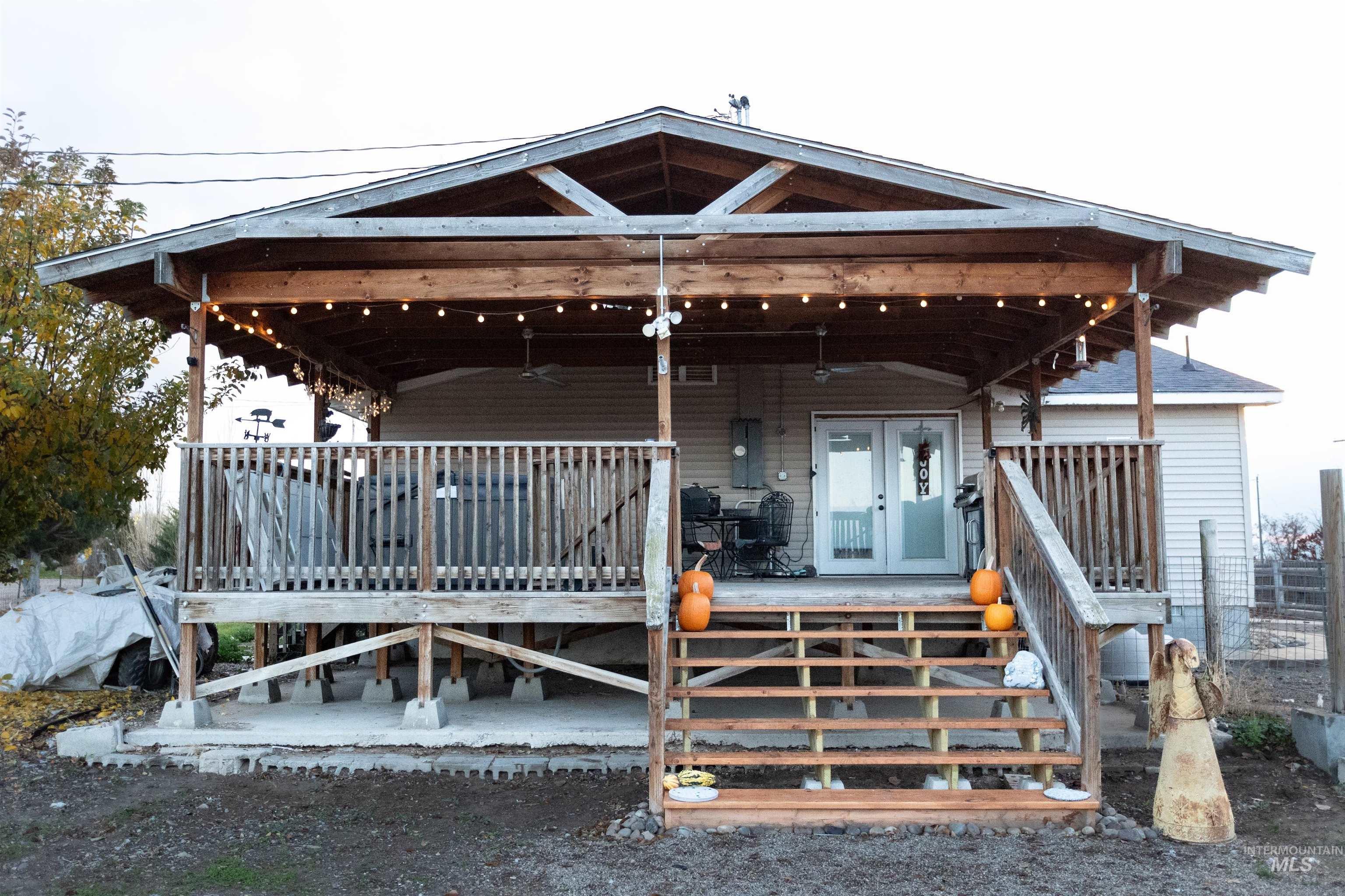 Back of property featuring a wooden deck