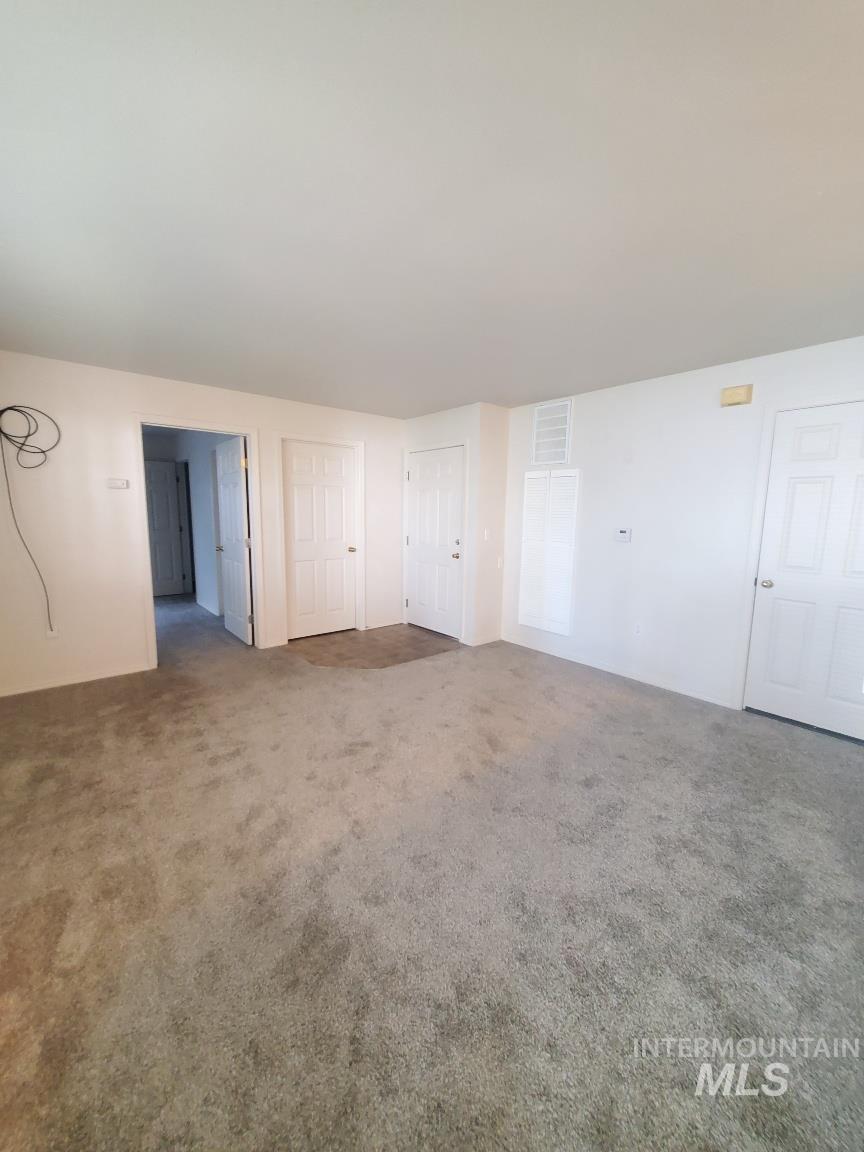 Unfurnished bedroom featuring carpet flooring