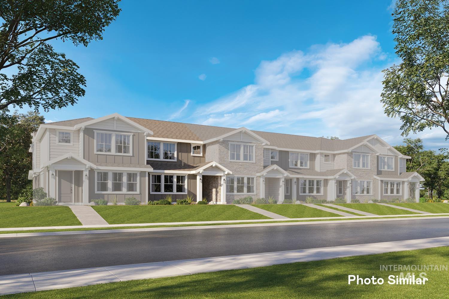 View of front facade with a front lawn and board and batten siding