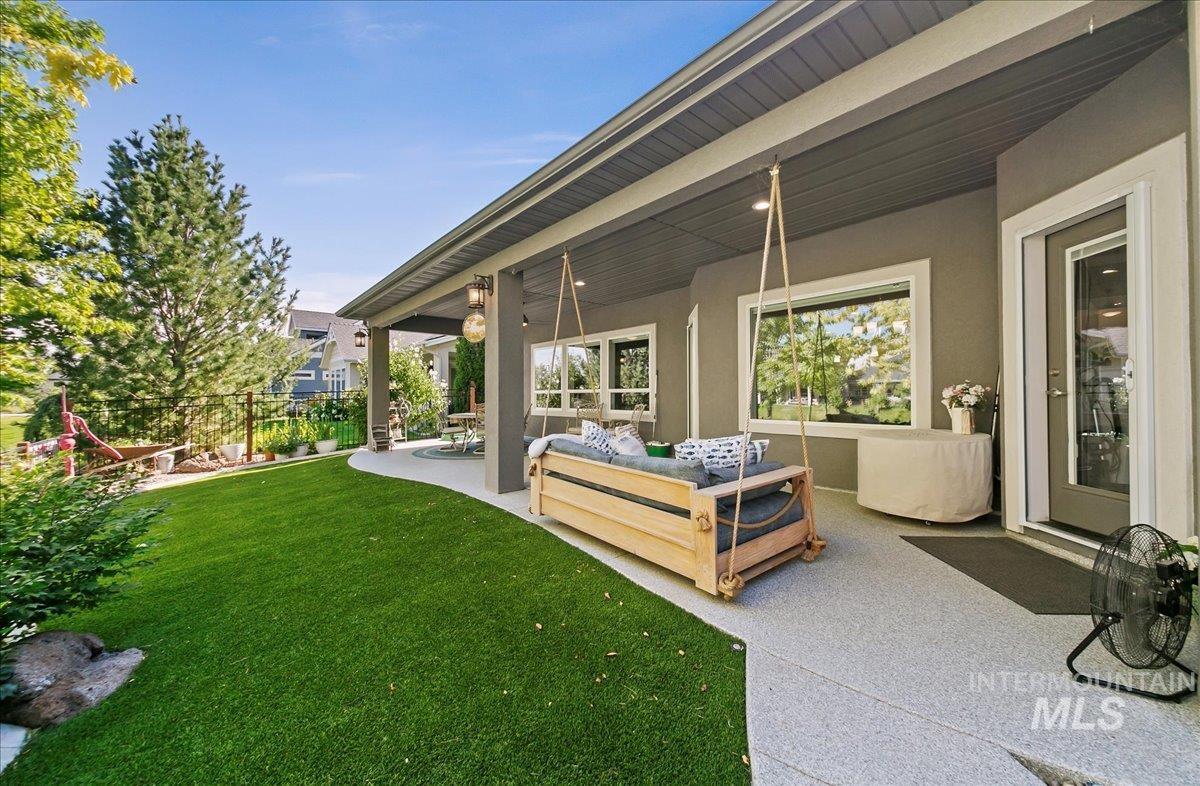 View of yard with an outdoor living space and a patio