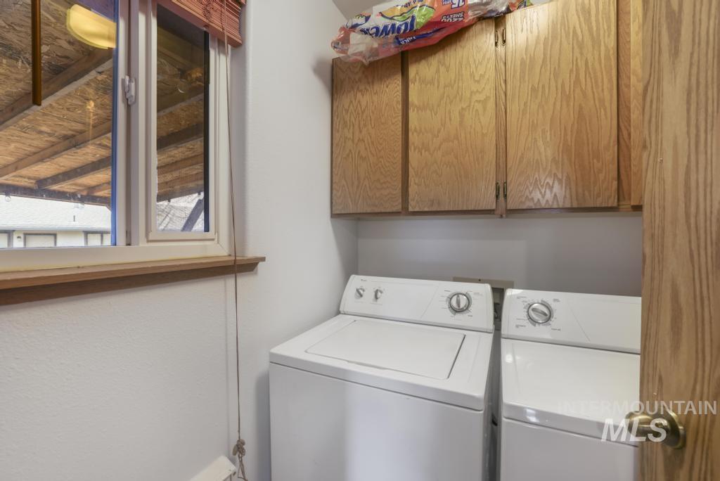Laundry room featuring cabinet space