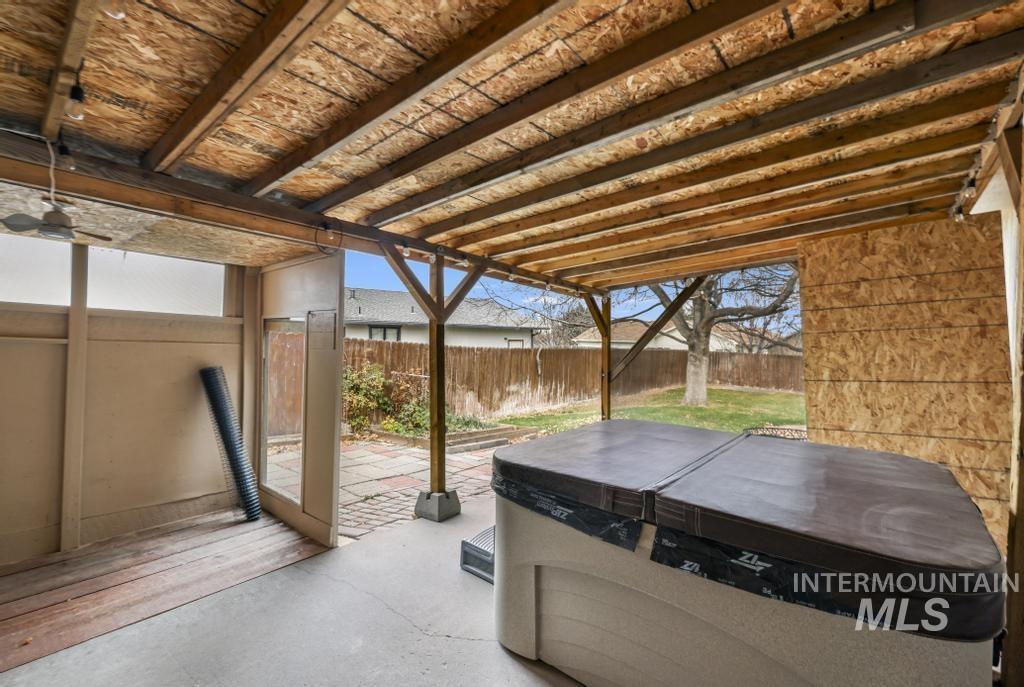 View of patio / terrace featuring a hot tub