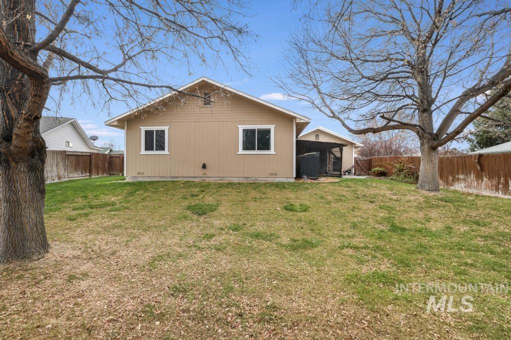 Back of house featuring a fenced backyard