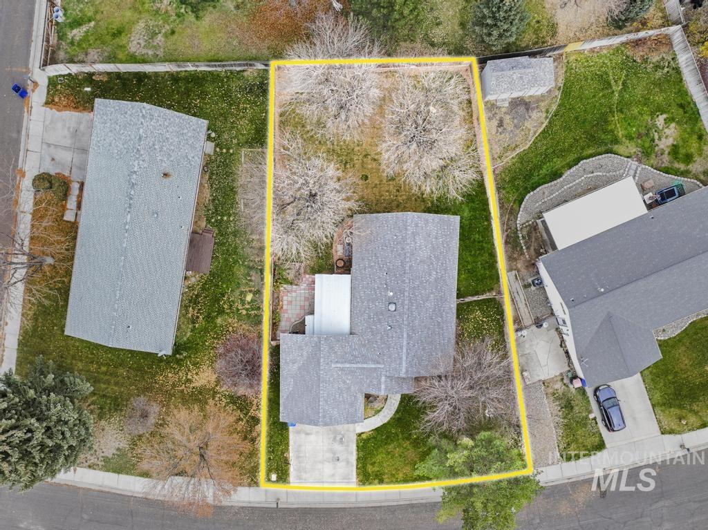 Aerial view of property and surrounding area with property parcel outlined