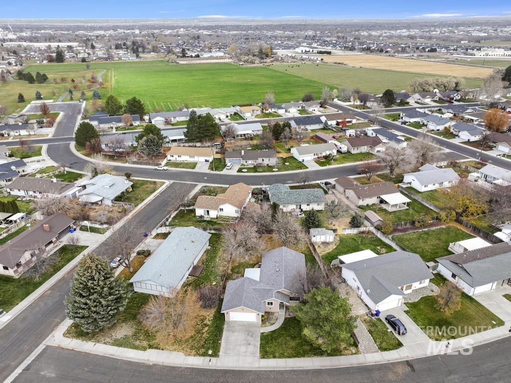 Aerial overview of property's location with nearby suburban area