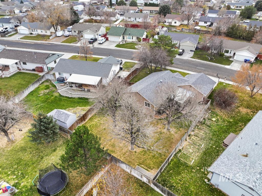 Aerial view of property's location with nearby suburban area