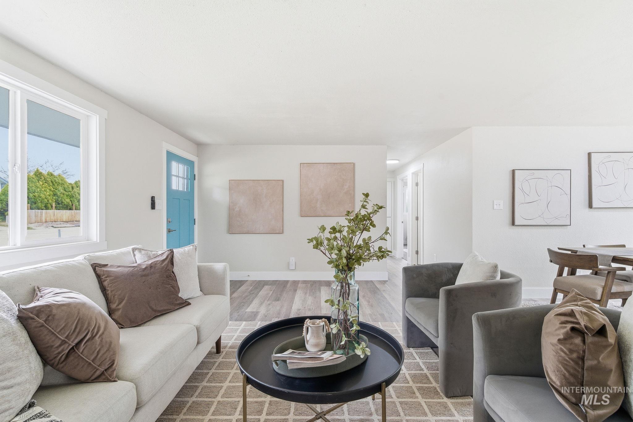 Living room with wood finished floors and baseboards