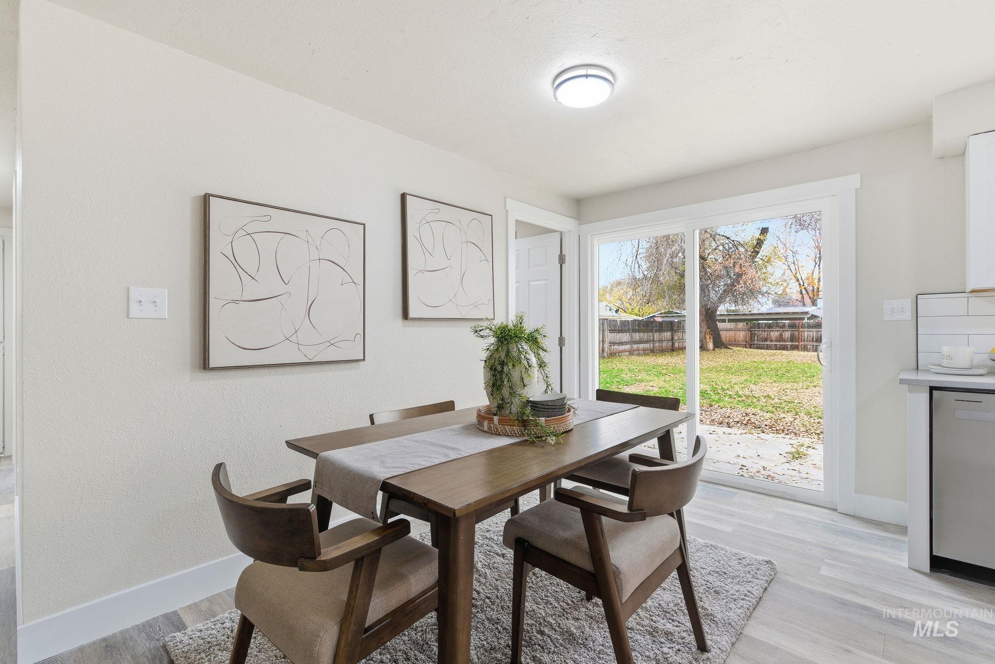 Dining room with light wood-style floors