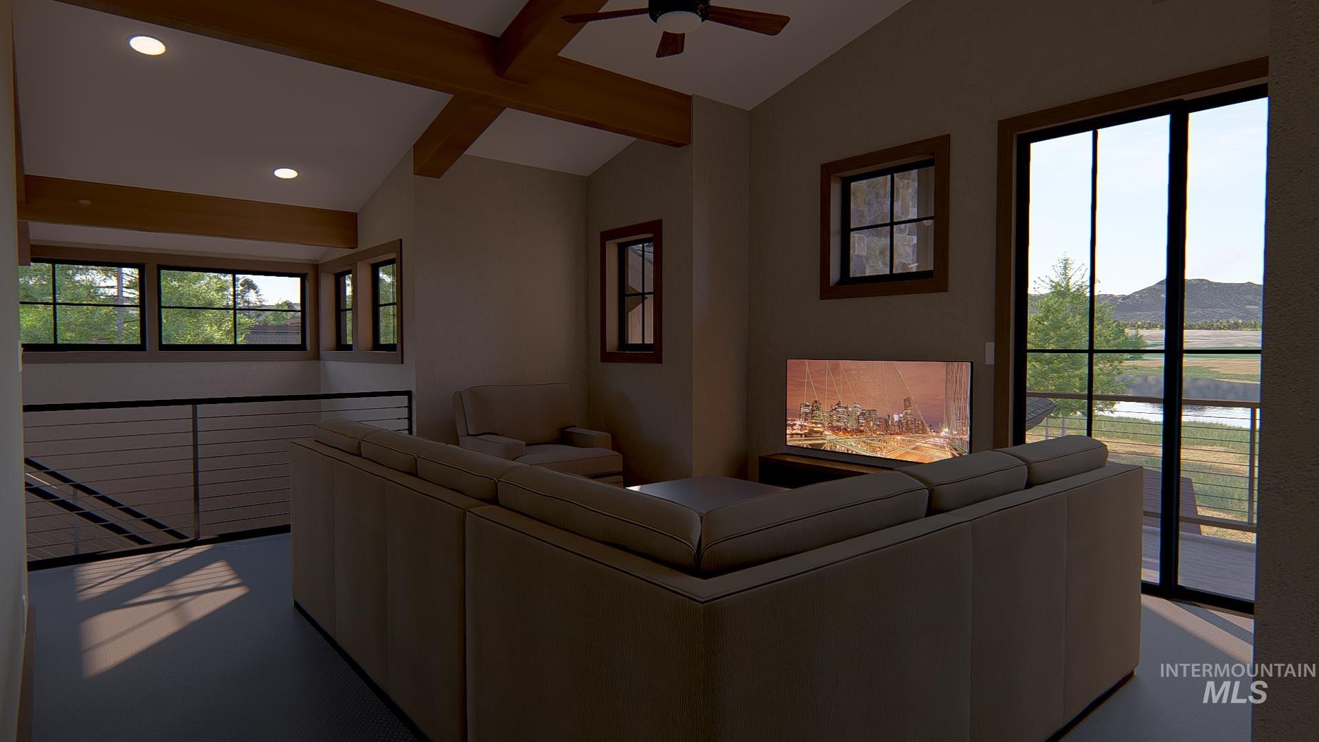 Living room with a ceiling fan and recessed lighting
