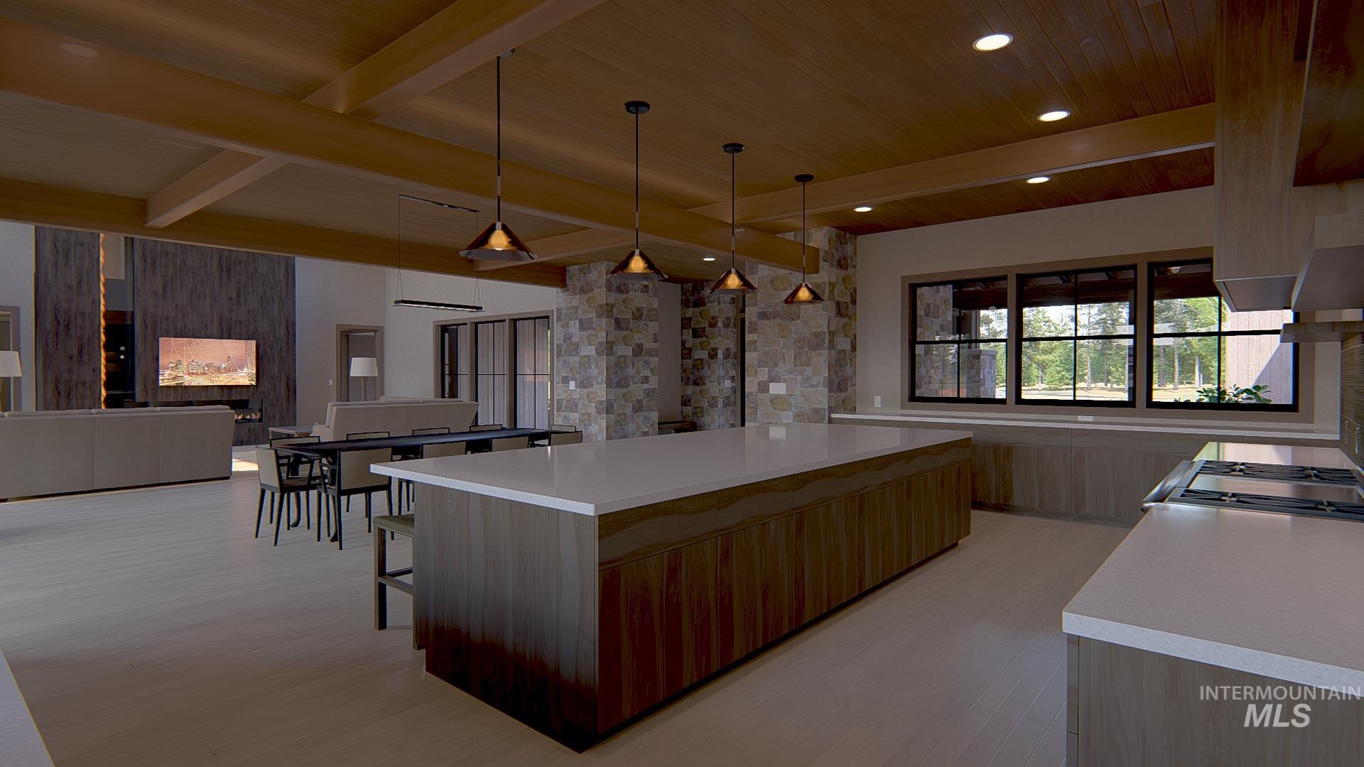 Kitchen with beamed ceiling, pendant lighting, open floor plan, modern cabinets, and light wood-style floors