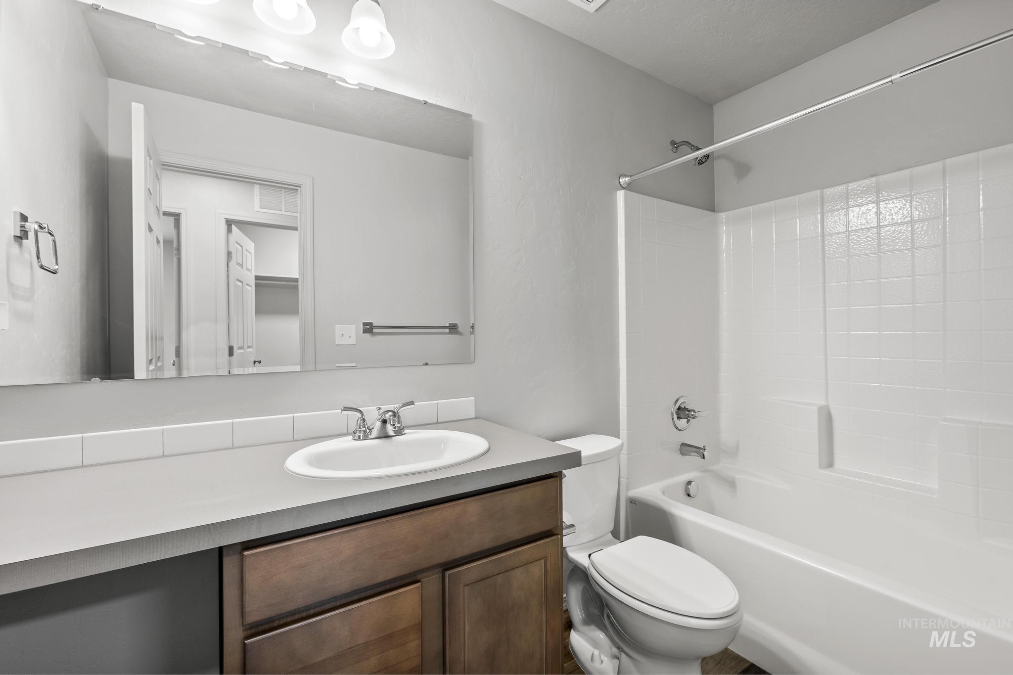 Full bathroom featuring vanity and shower / tub combination