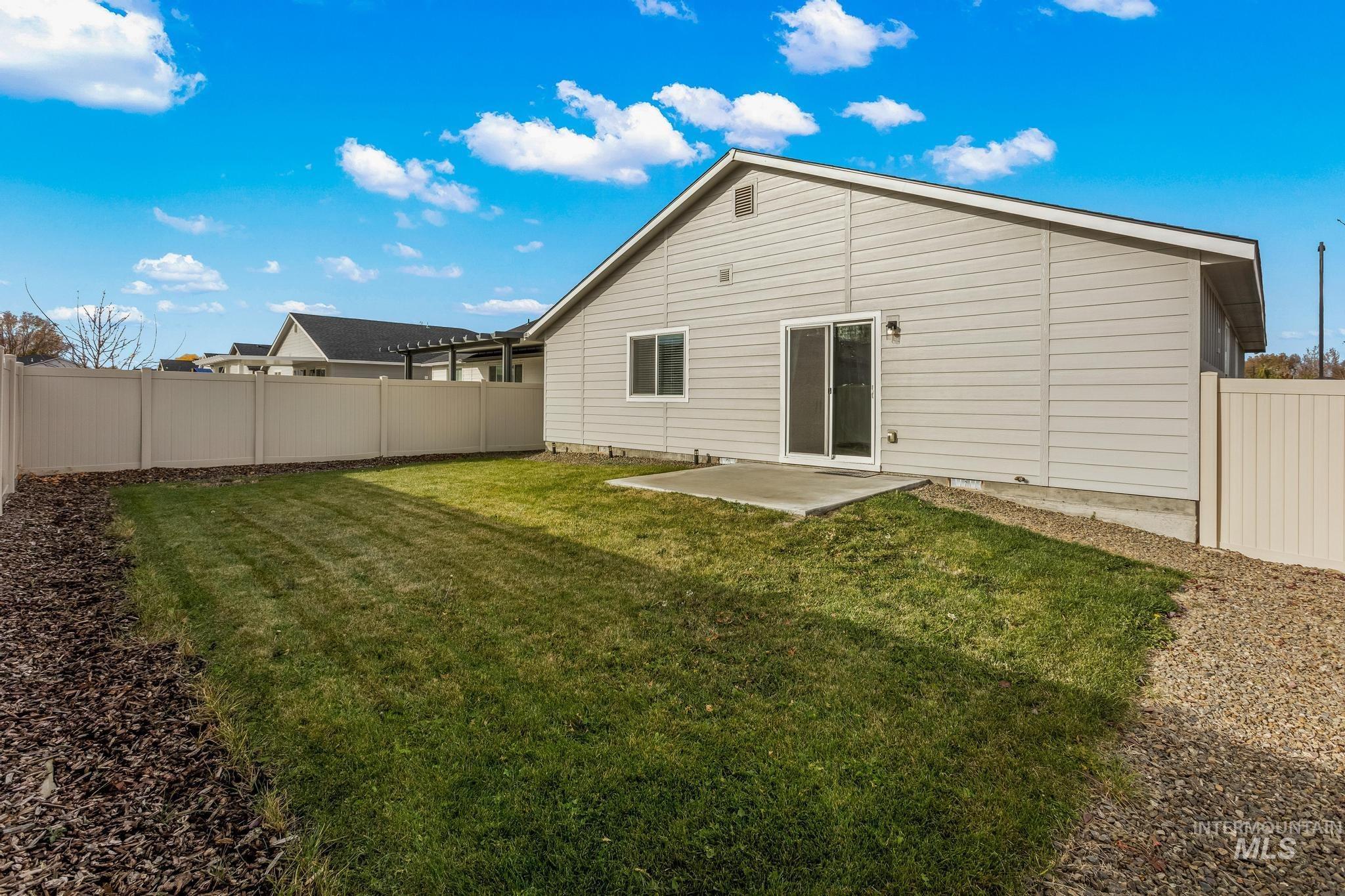 Back of house featuring a patio and a fenced backyard