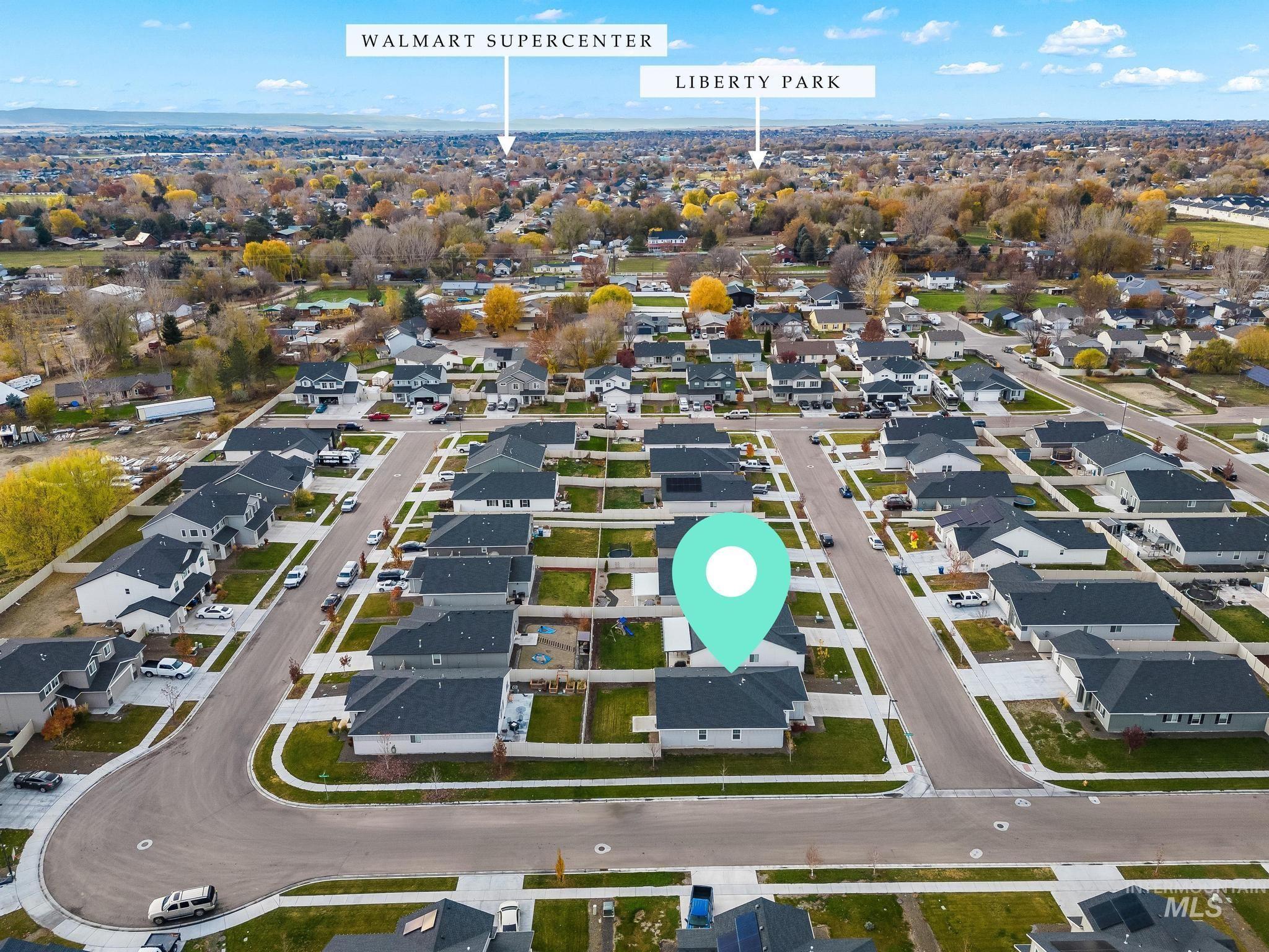 Aerial overview of property's location featuring nearby suburban area
