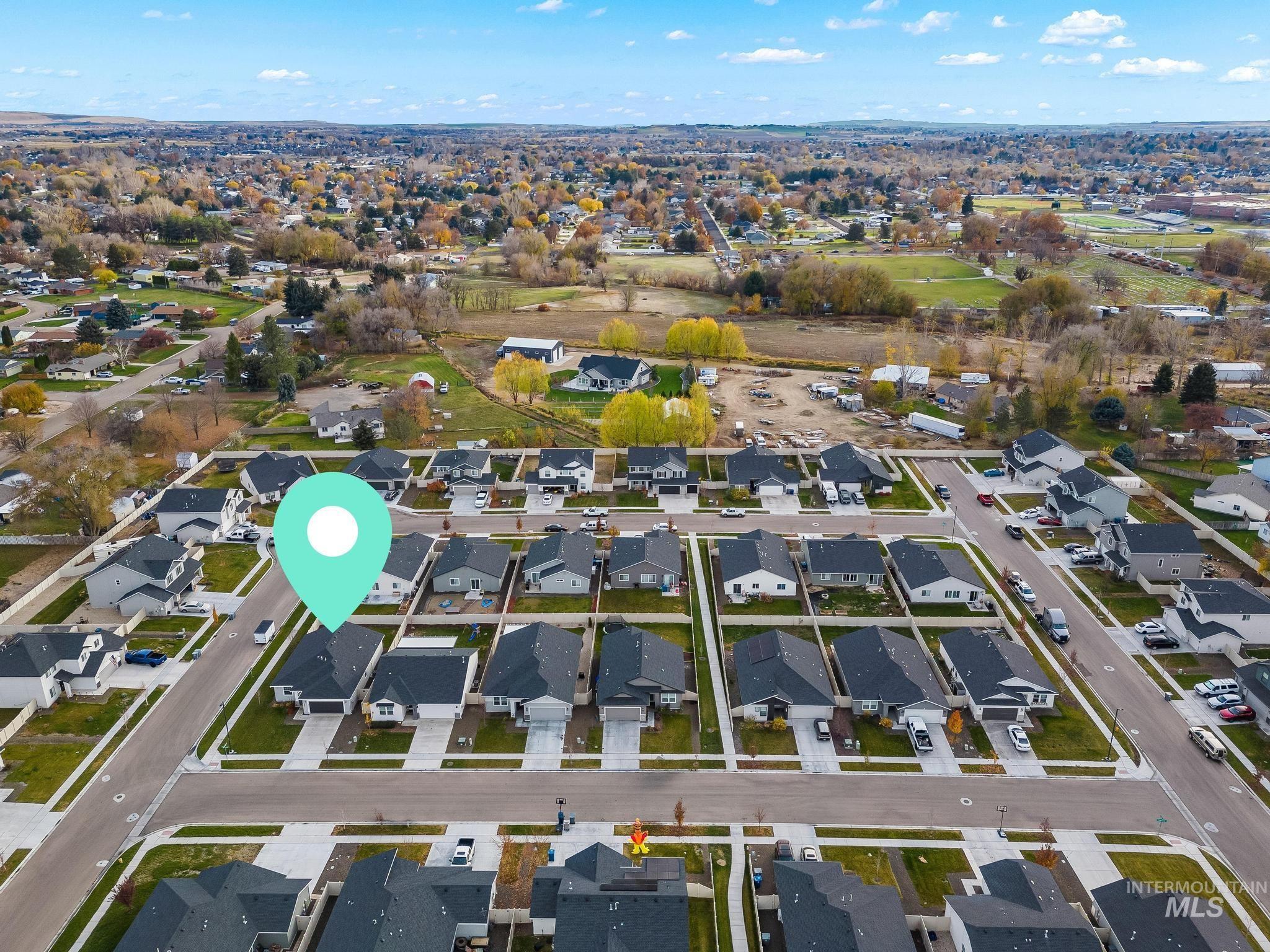 View of property location with nearby suburban area