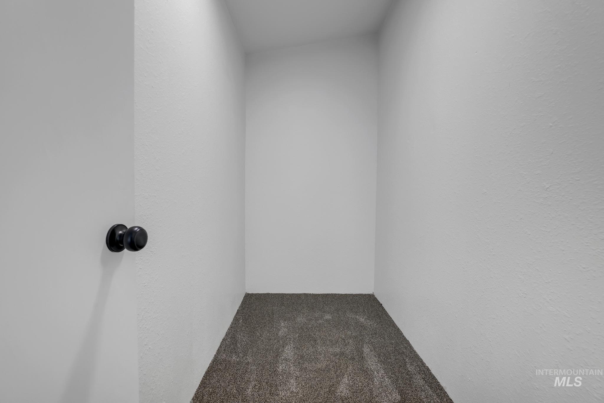 Empty room with carpet flooring