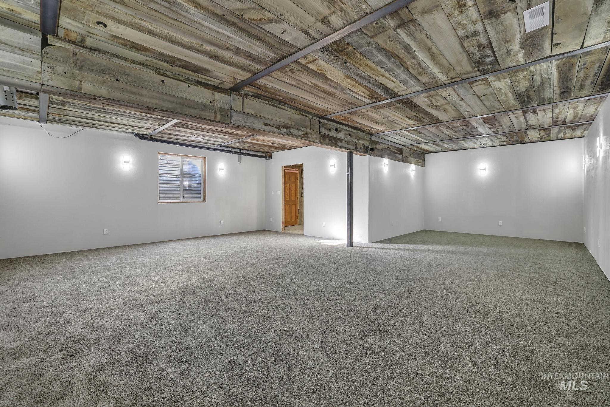 Below grade area featuring carpet flooring