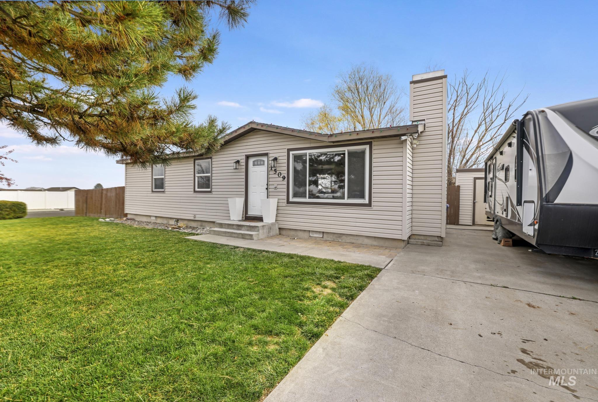 View of front of home featuring a chimney