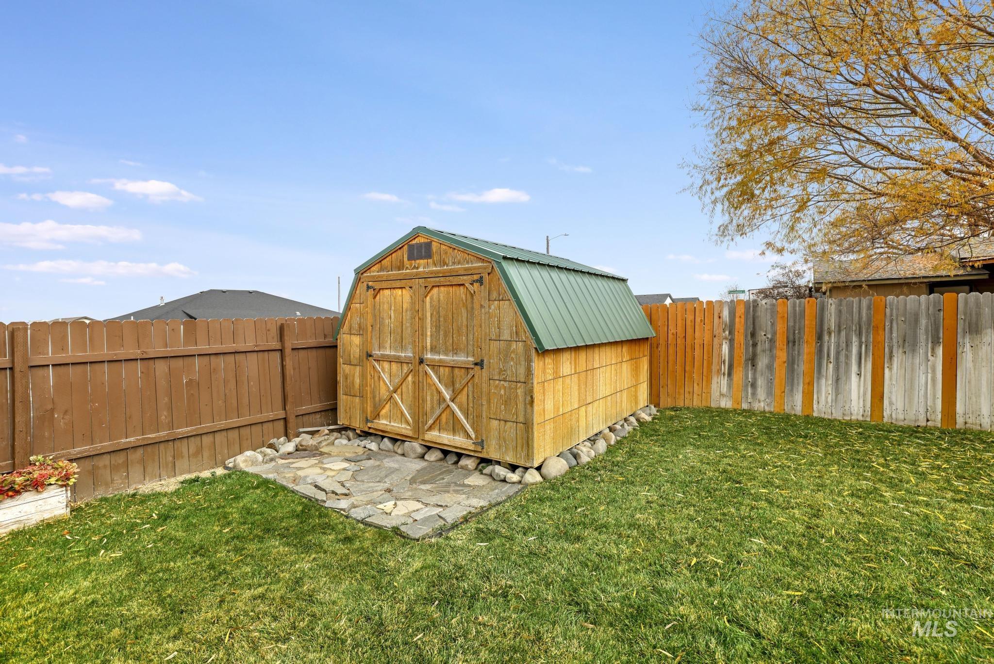 View of shed featuring a fenced backyard