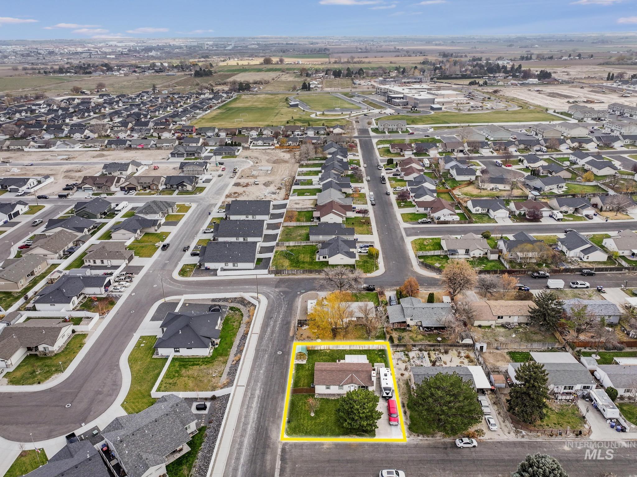 View of property location featuring property boundaries highlighted and nearby suburban area