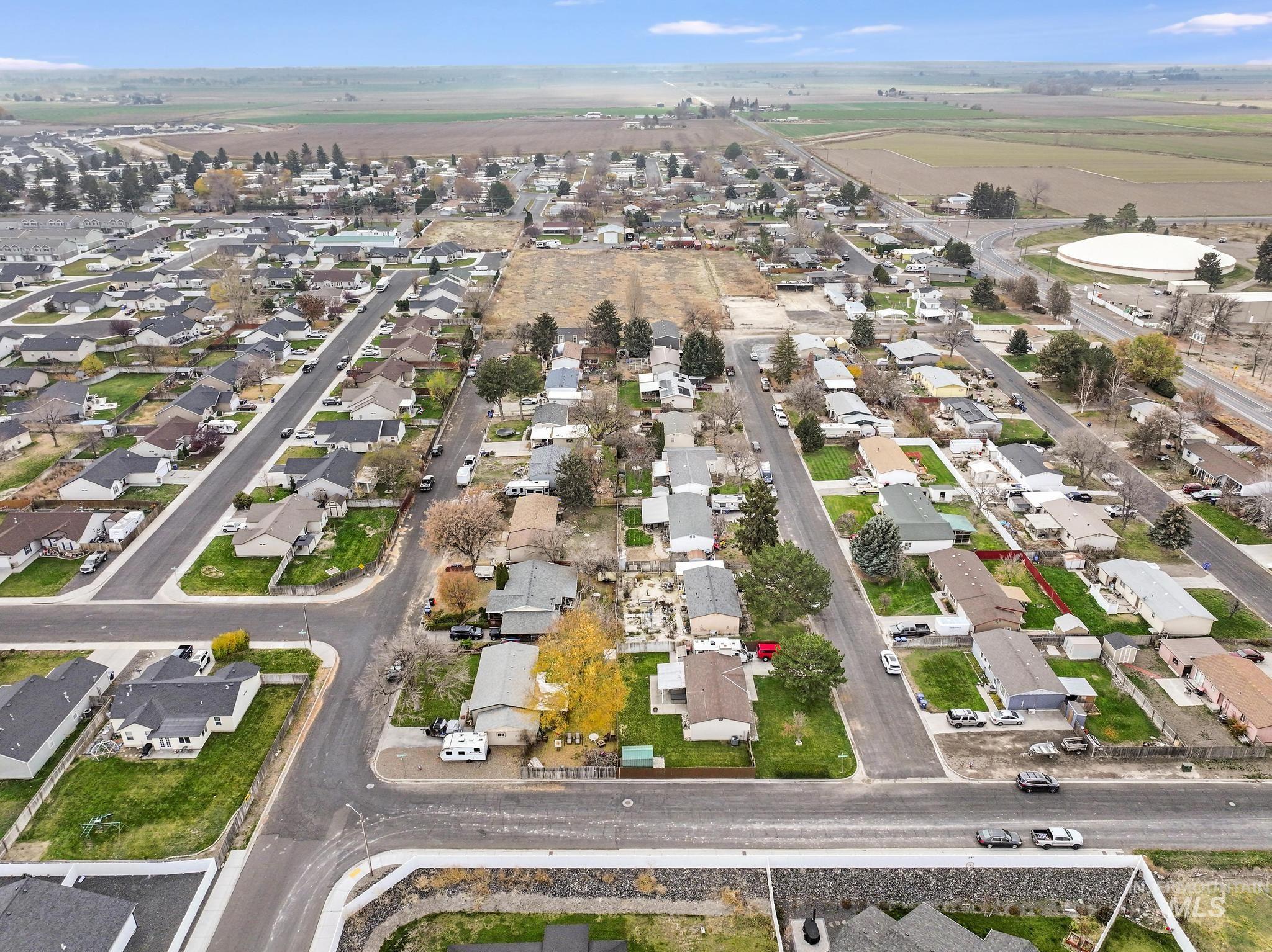 Aerial overview of property's location featuring nearby suburban area
