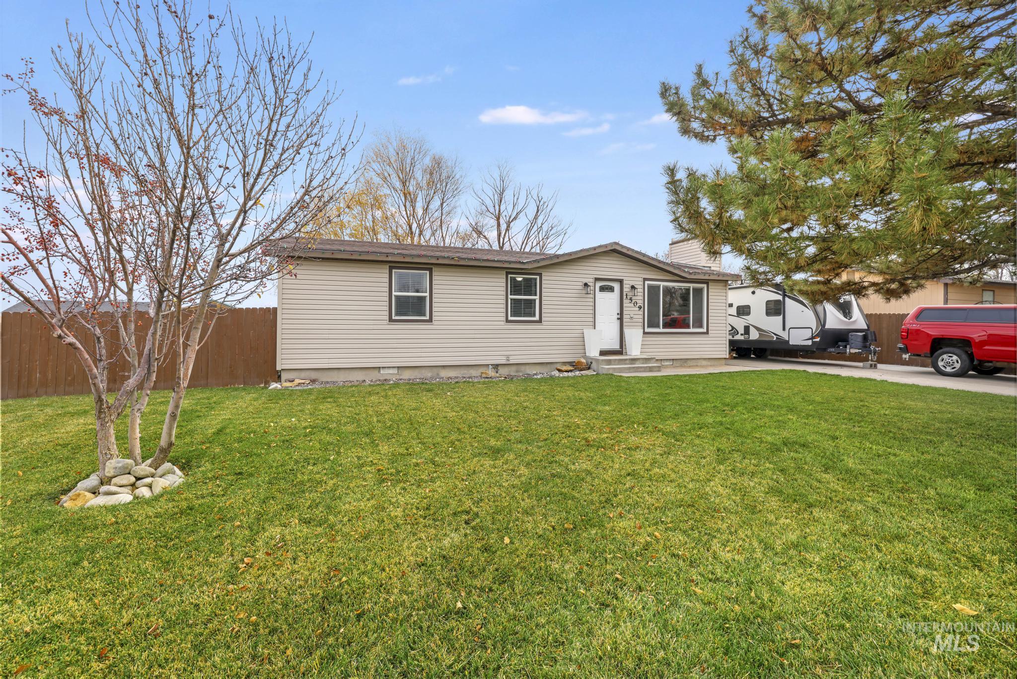 Single story home with a chimney and entry steps