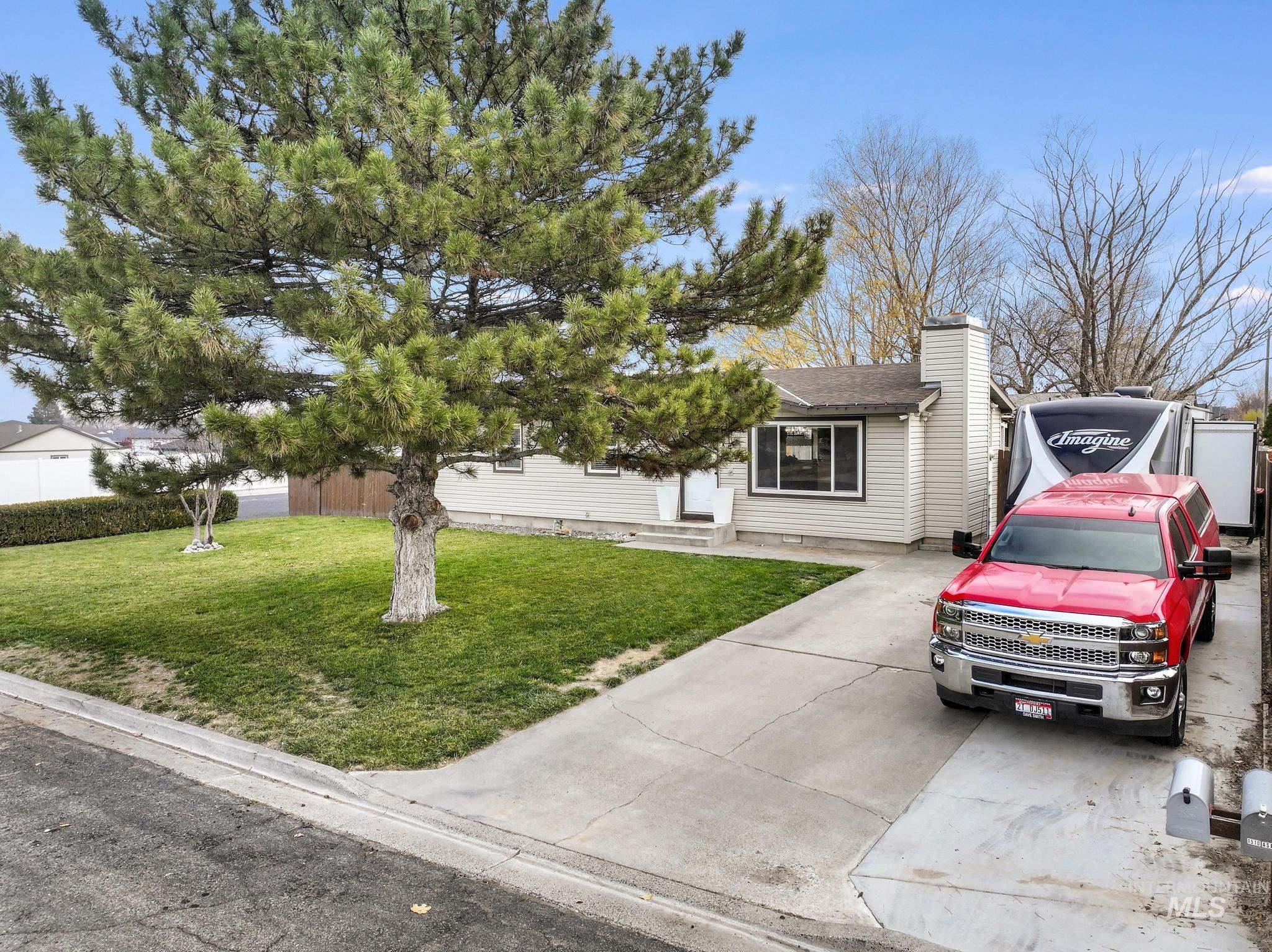 View of front of property featuring a front lawn and a chimney