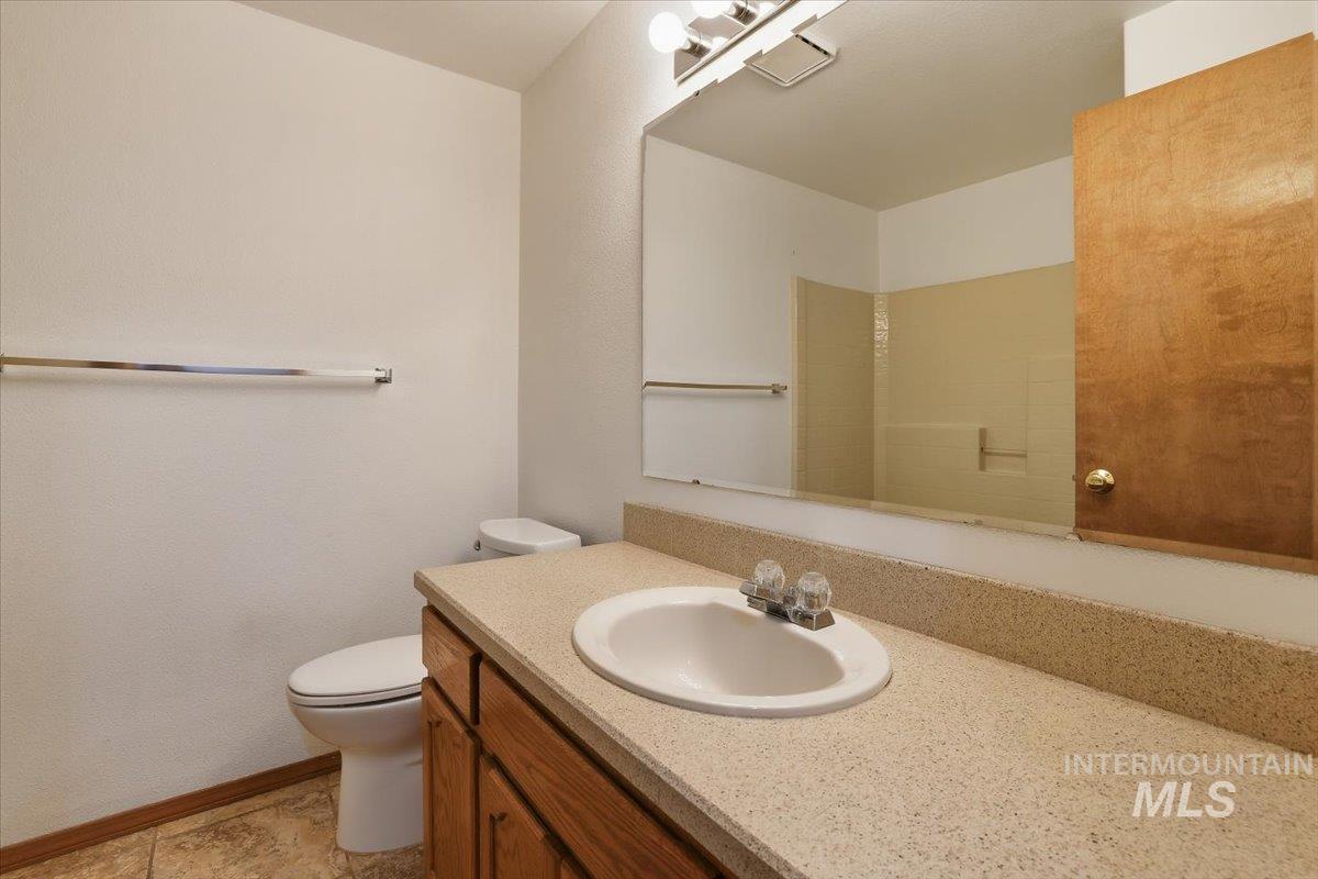 Bathroom featuring vanity and light tile patterned floors