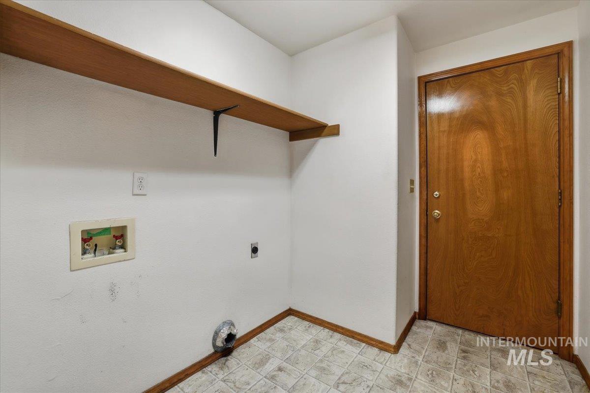 Laundry room featuring washer hookup and hookup for an electric dryer