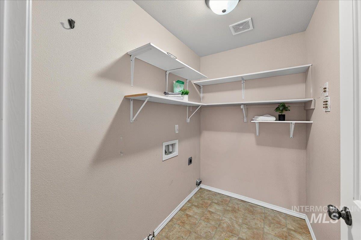 Laundry room featuring hookup for a washing machine and hookup for an electric dryer