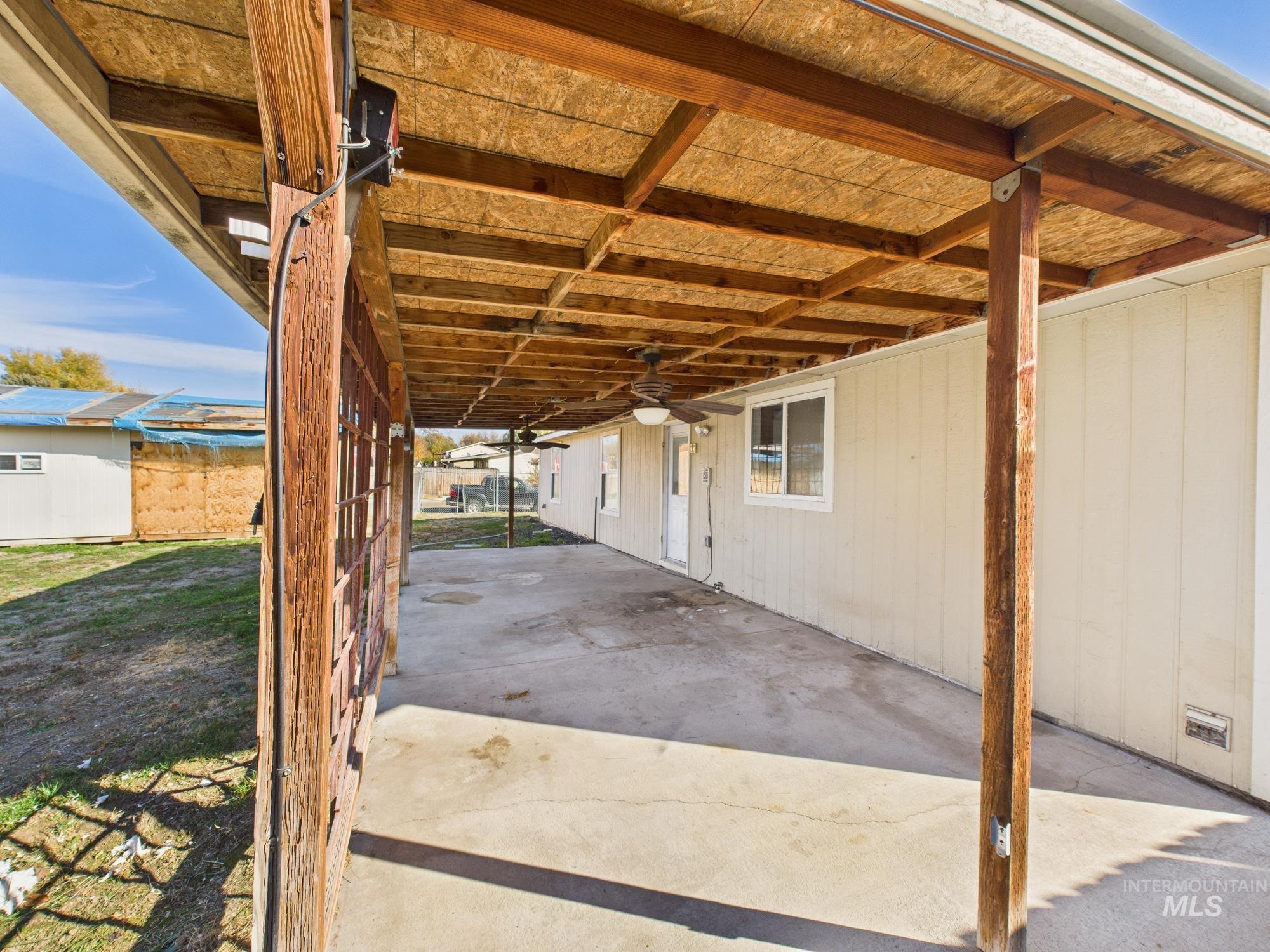 View of patio with ceiling fan