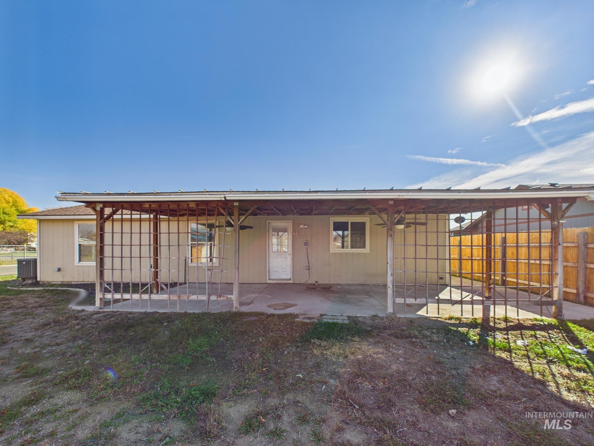 Rear view of property with a patio
