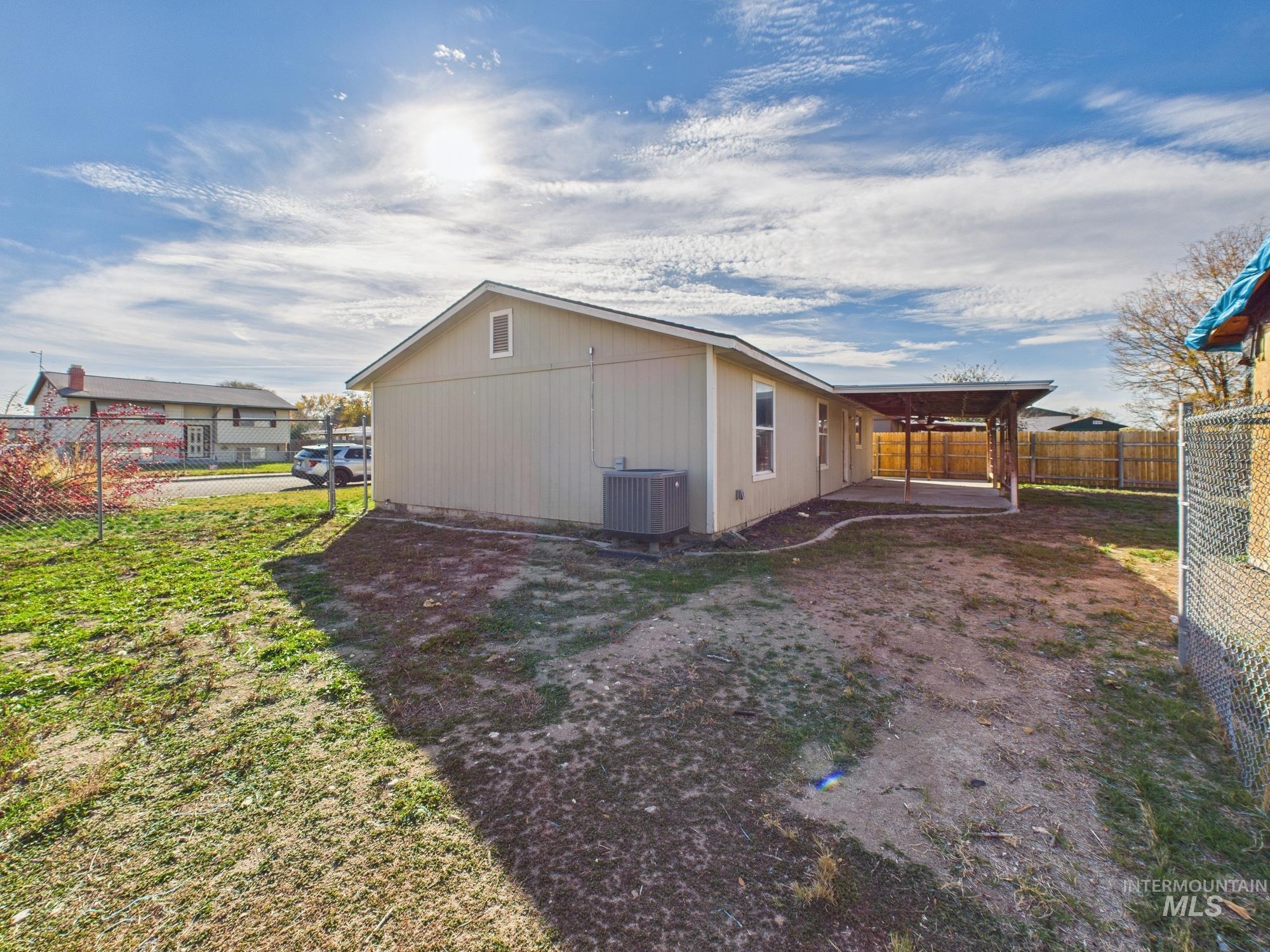 Rear view of property with a patio
