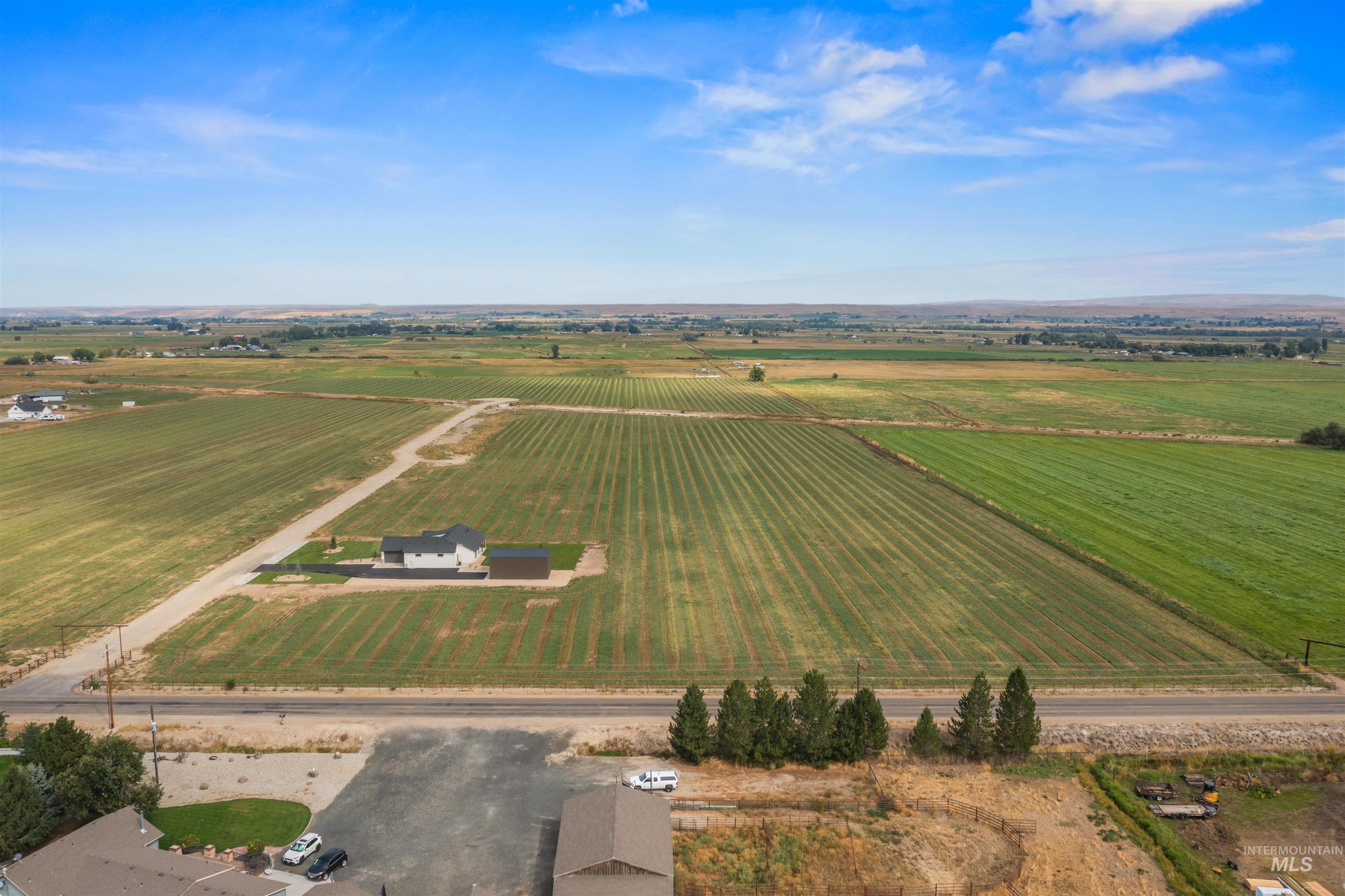 View of rural area featuring large plots for crops