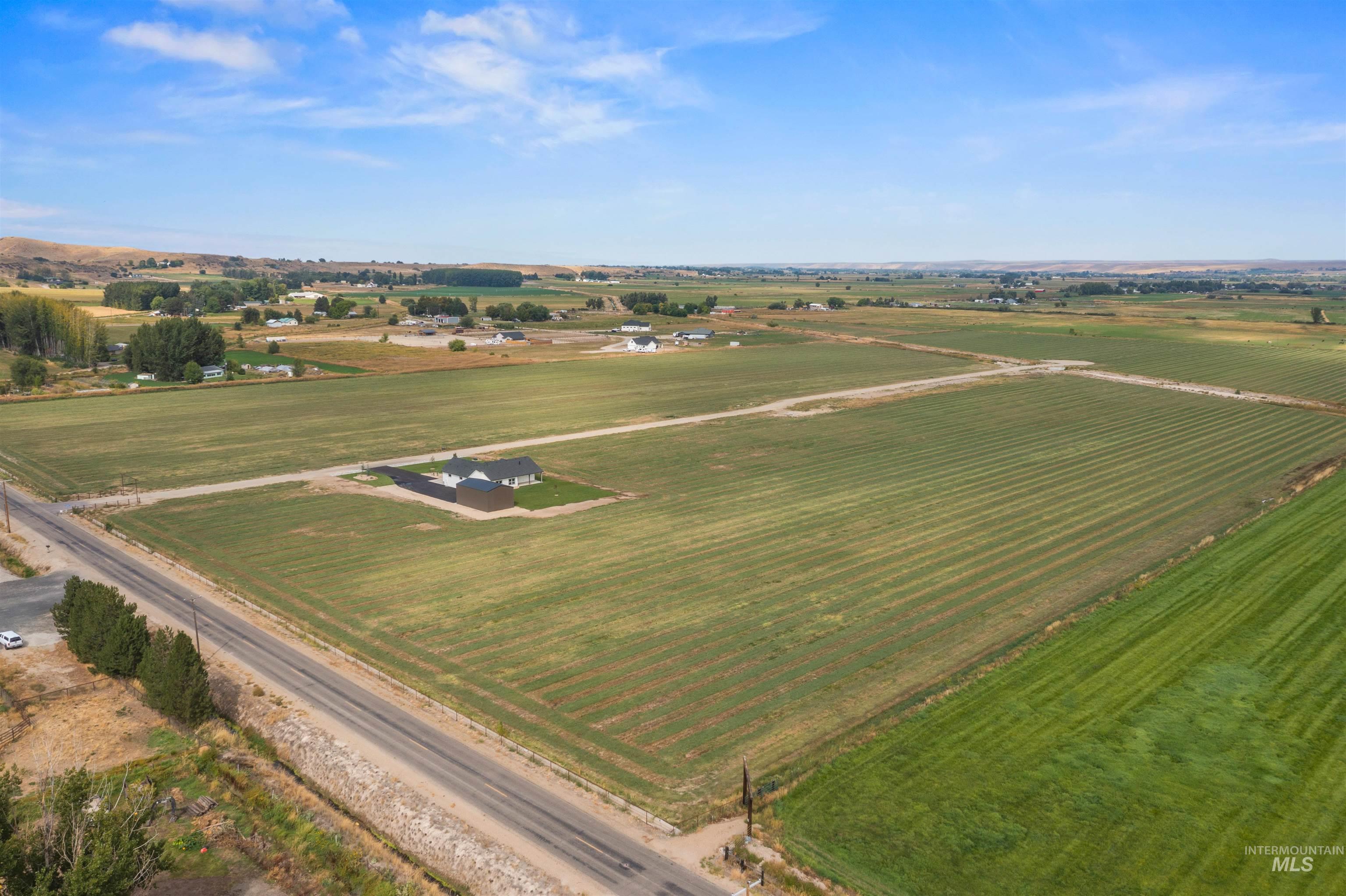 Aerial view of sparsely populated area featuring extensive farmland