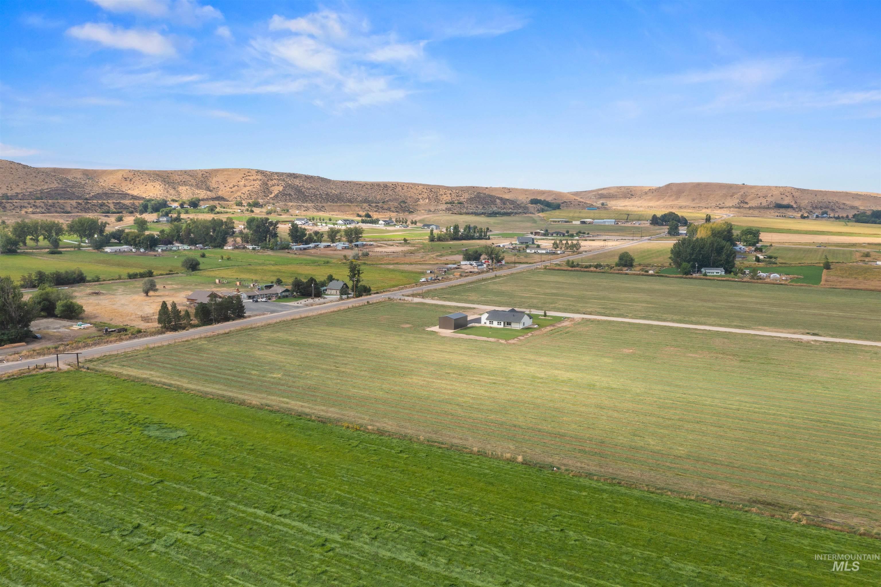 Overview of rural landscape with a mountain backdrop