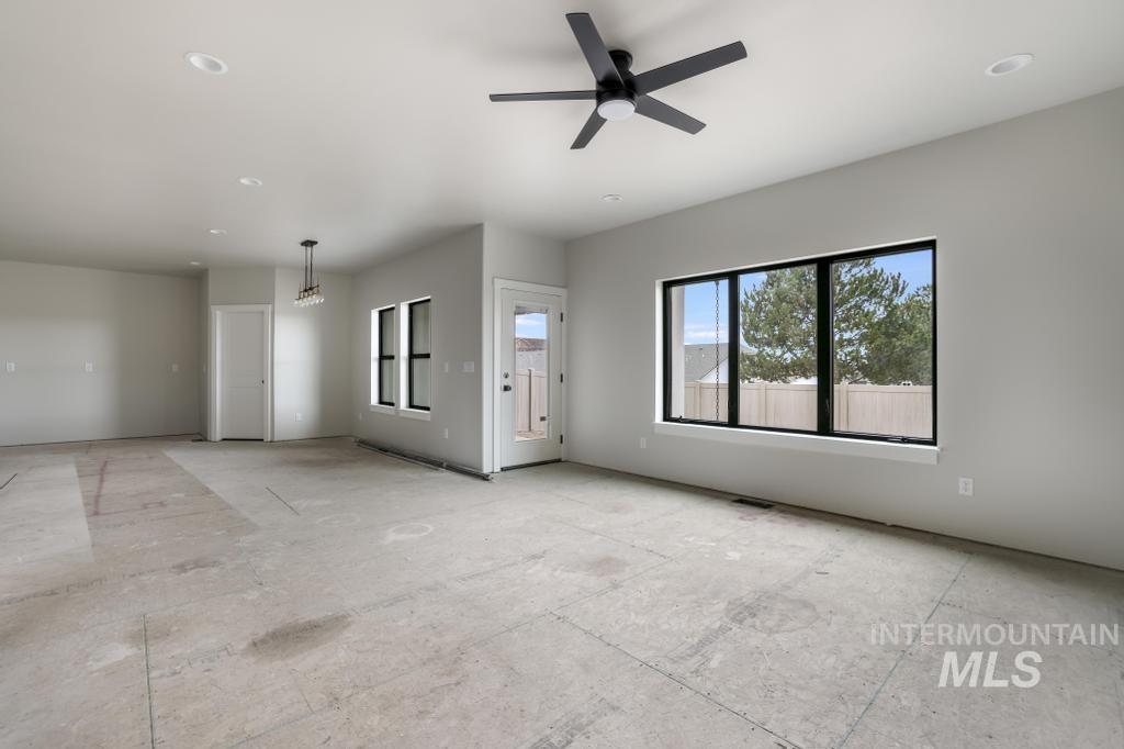 Unfurnished living room with recessed lighting and ceiling fan
