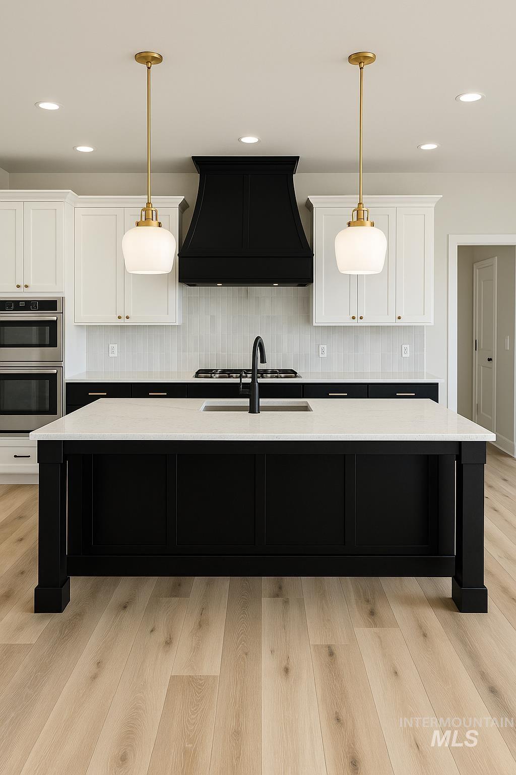 Kitchen with dark cabinetry, tasteful backsplash, white cabinetry, custom exhaust hood, and recessed lighting