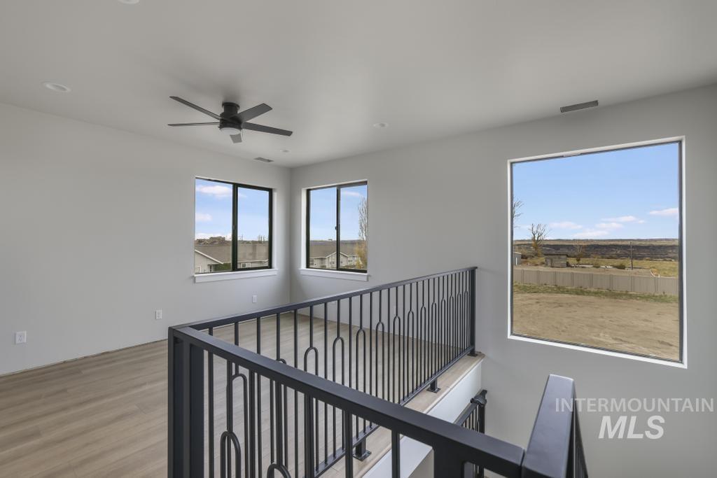Hallway featuring light wood finished floors