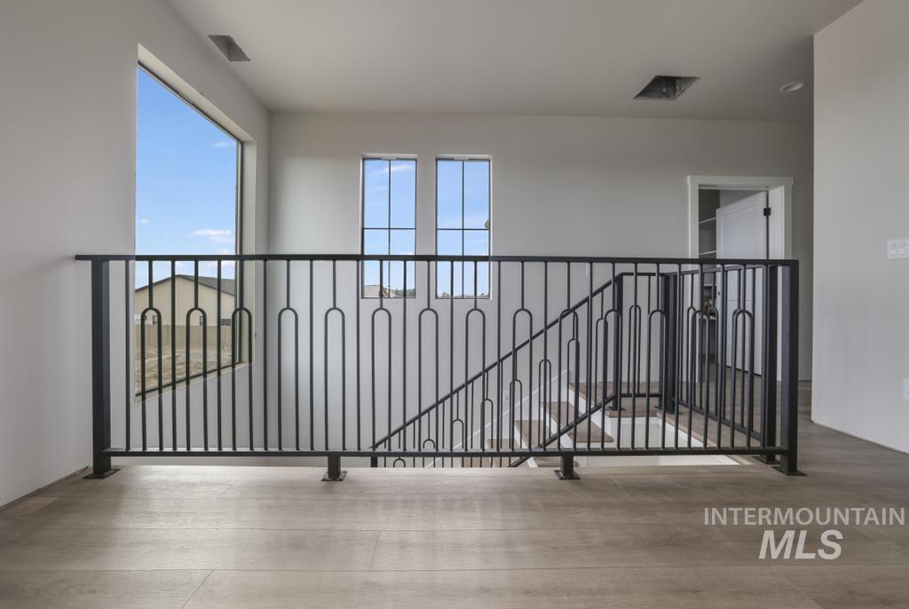 Corridor featuring an upstairs landing