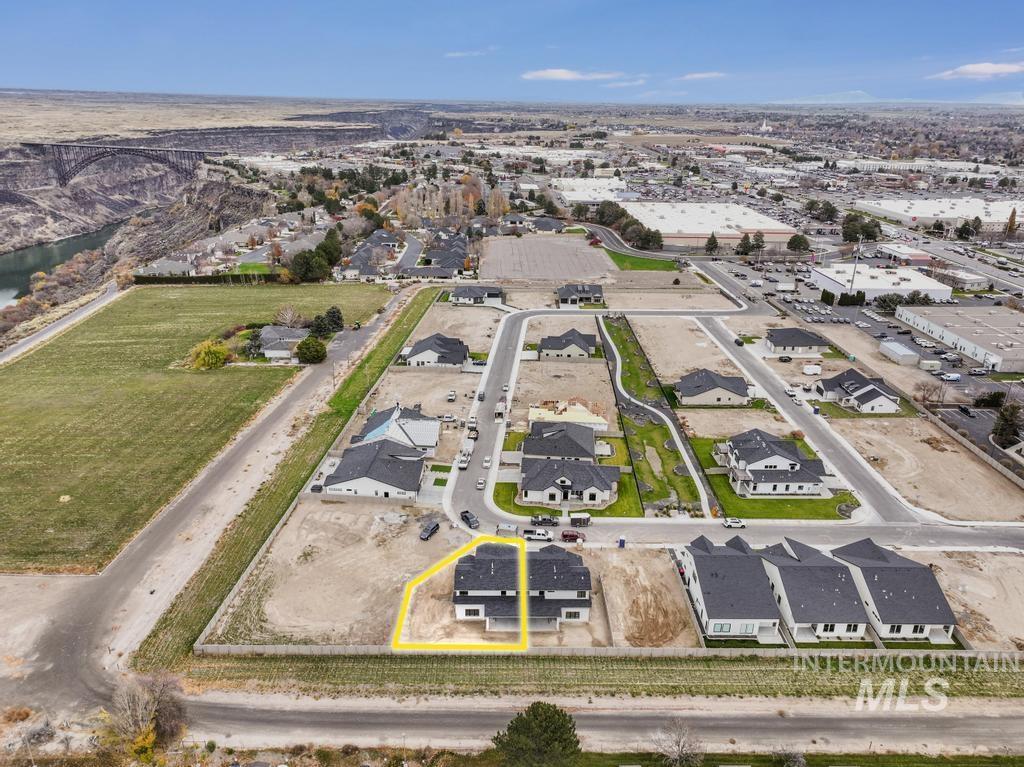 Aerial view of property and surrounding area with property boundaries highlighted